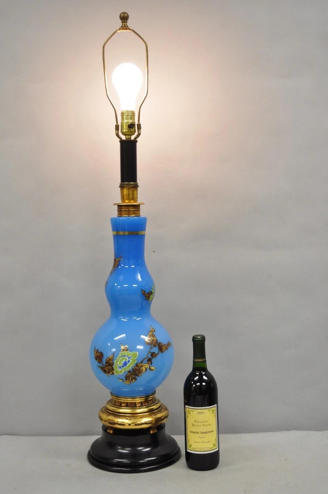 Vintage Chinoiserie James Mont Style Blue Glass Gold Gilt Tall Table Lamp with Floral Painted Details. Circa Mid 20th Century. Measurements: 40