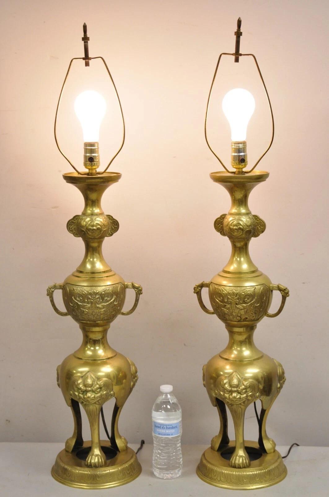 Vintage Chinoiserie James Mont Style Brass Chinese Foo Dog Table Lamps a Pair. Circa Mid 20th Century. Dimensions : 39