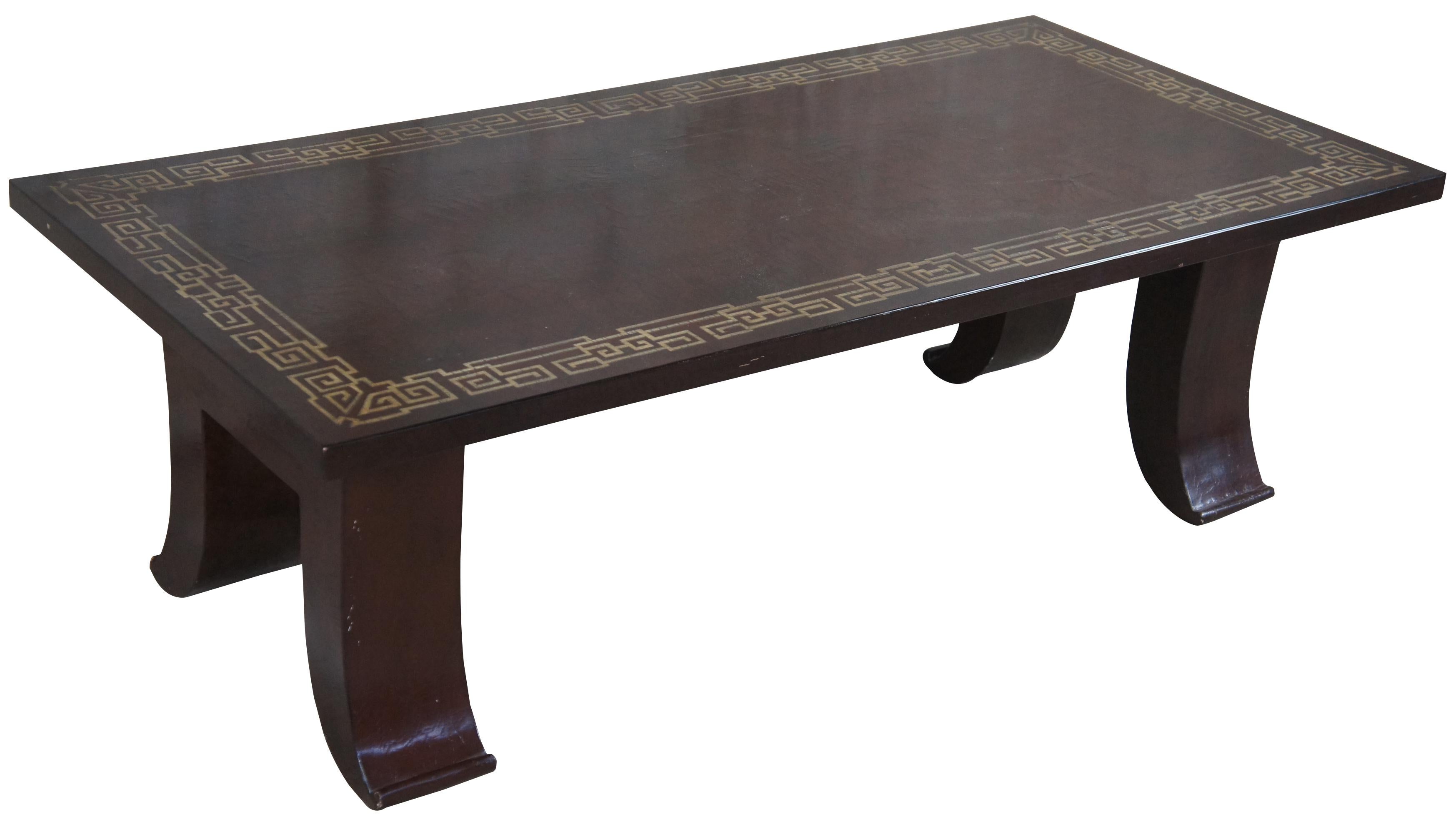 20th century lacquered wood chinoiserie coffee table. Features a rectangular form top with geometric Greek key inlay. The table is supported by flared legs.

Provenance: Estate of Carol Levitan and Jesse Philips
Mr. Philips was both a retailer, as
