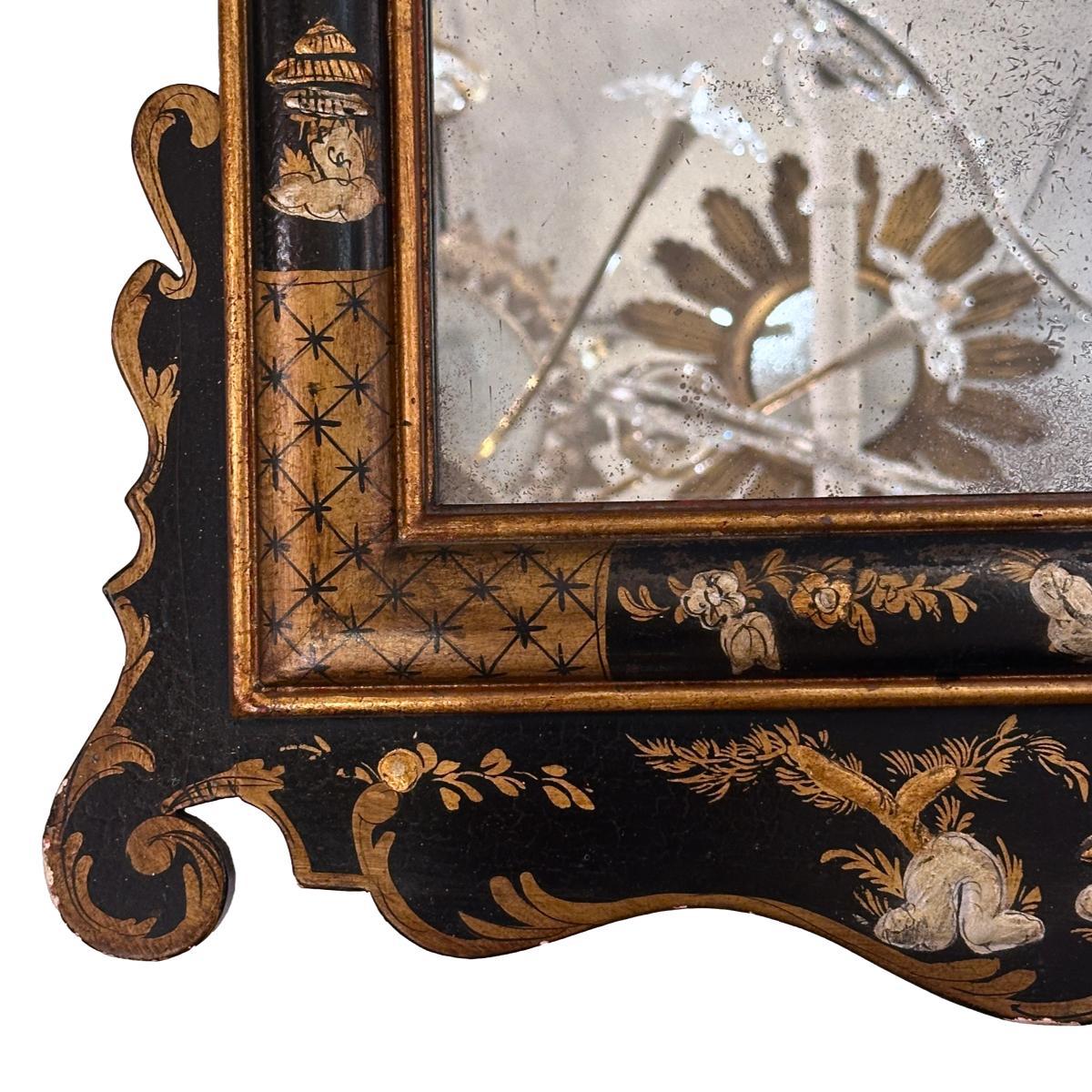 A circa 1960's English Chinoiserie mirror with gilt details.

Measurements:
Height: 51