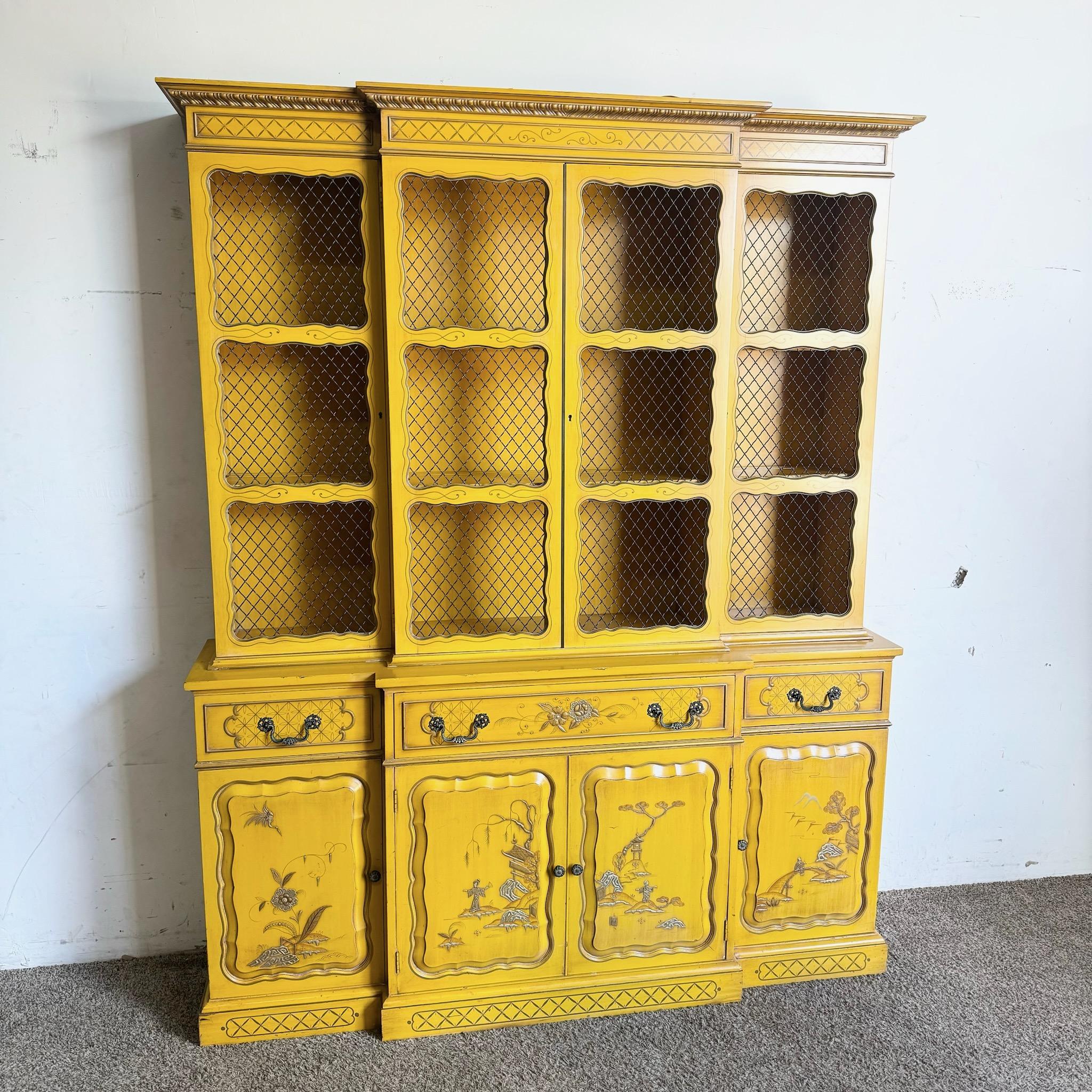 Make a bold statement with this vintage Chinoiserie mustard yellow hand-painted china cabinet/breakfront. Featuring intricate hand-painted detailing and a striking mustard yellow finish, this cabinet offers both ample storage and a vibrant, artistic