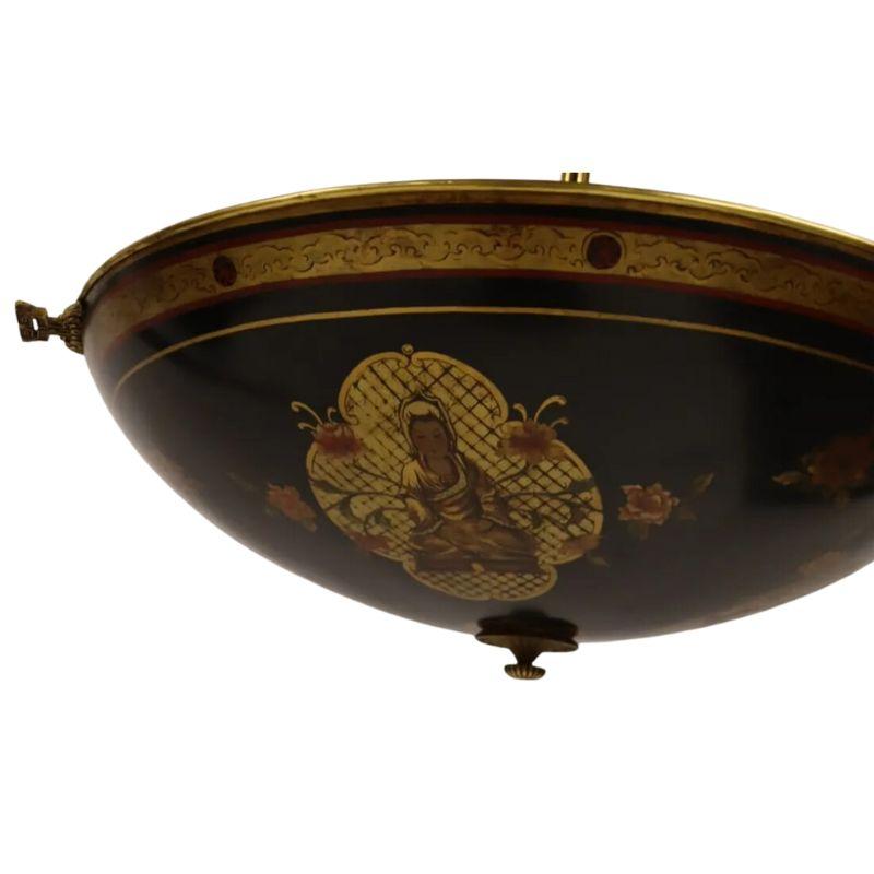 A vintage painted tole and mirror pendant.  The reverse umbrella form pendant is painted tole outside and mirrored inside with brass details. The tole light is painted black, decorated with three figures and flowers, banded with a gold painted rim. 