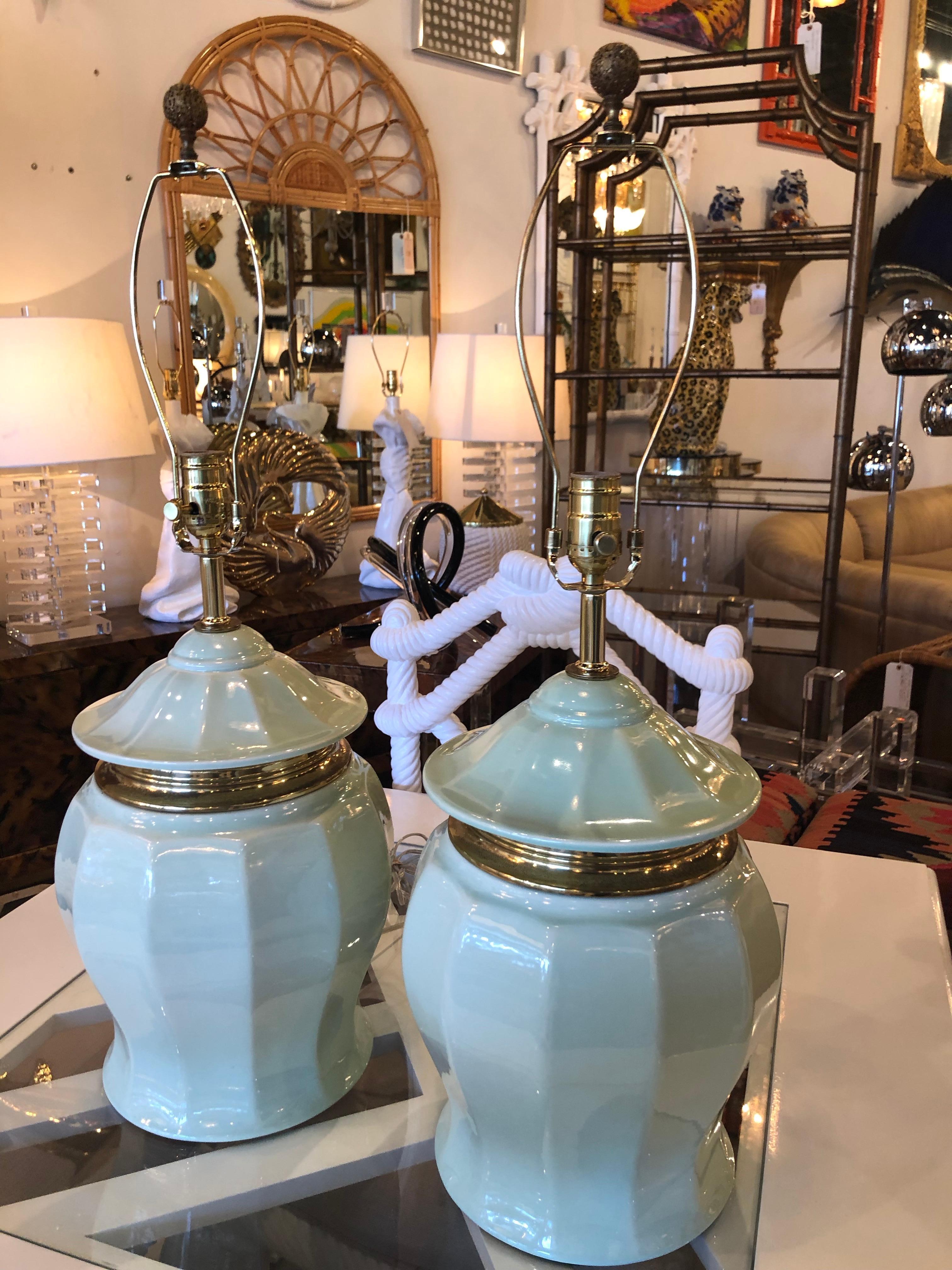 Lovely pair of vintage mint green, pagoda top, ginger jar, table lamps. Brass accents with brass hardware. New wiring. Original brass filagree finials. 
Lamps measure 19