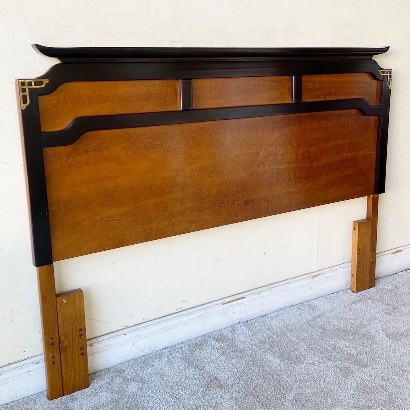 Exceptional vintage chinoiserie queen size headboard by Bassett Furniture. Features black edges with brass accents.
 