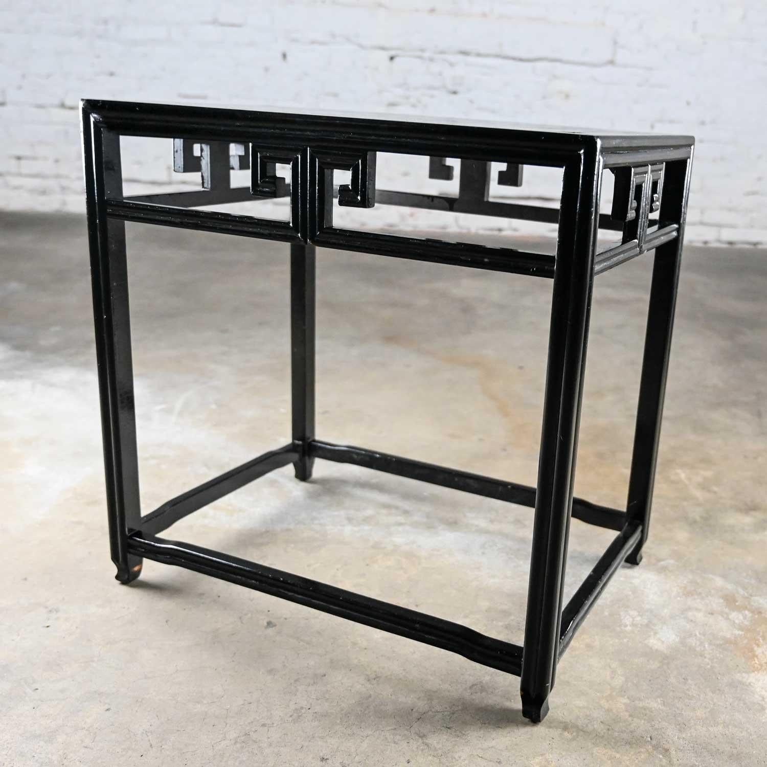 Handsome vintage Chinoiserie rectangular black painted accent or side table by Baker. Beautiful condition, keeping in mind that this is vintage and not new so will have signs of use and wear. It has been touched up but no outstanding flaws found. It