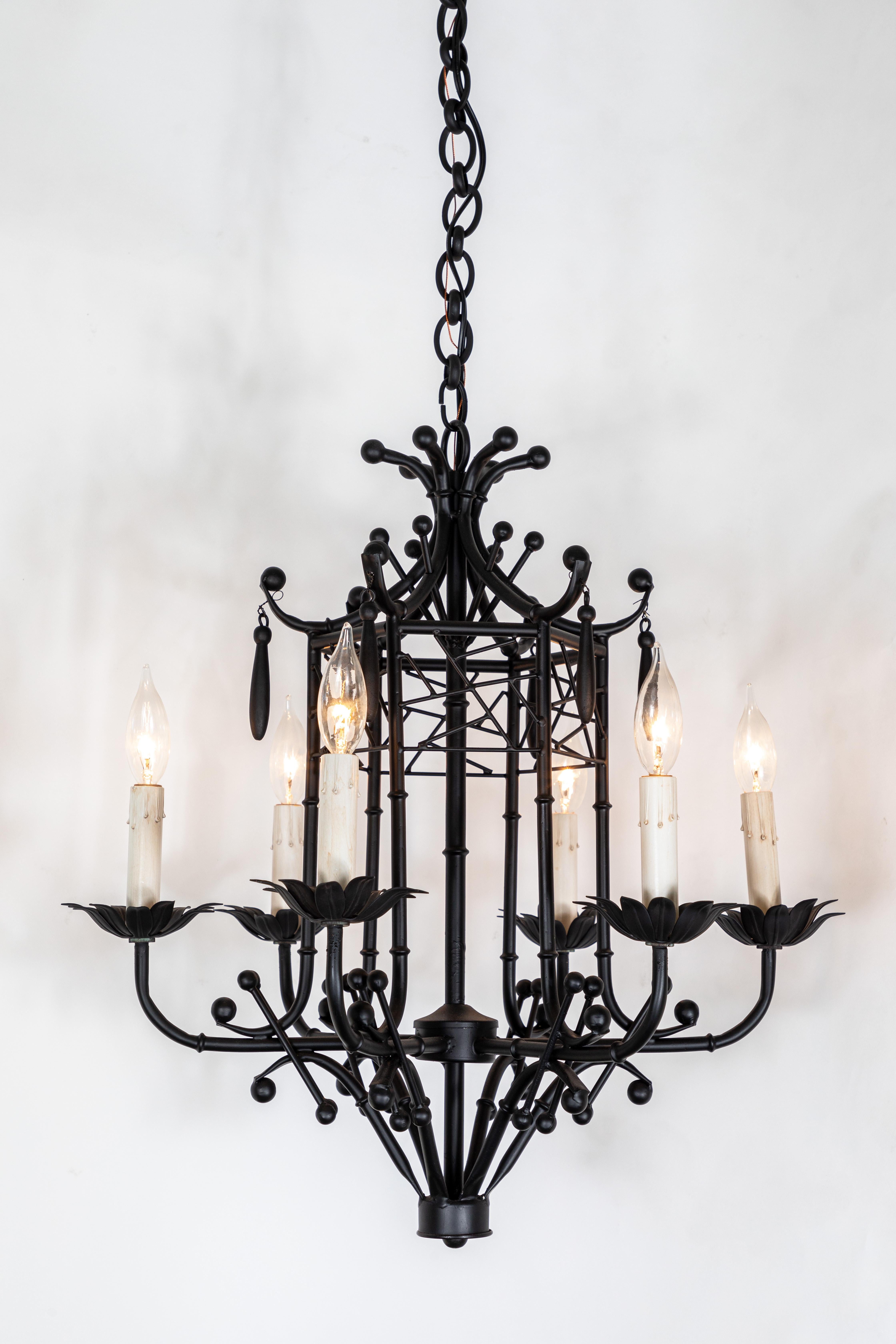 Vintage chinoiserie style 6-arm hanging chandelier with faux bamboo, pagoda styling, and drops. This piece has a new black powder coated finish and has been newly rewired. 

Made in Italy.    
  