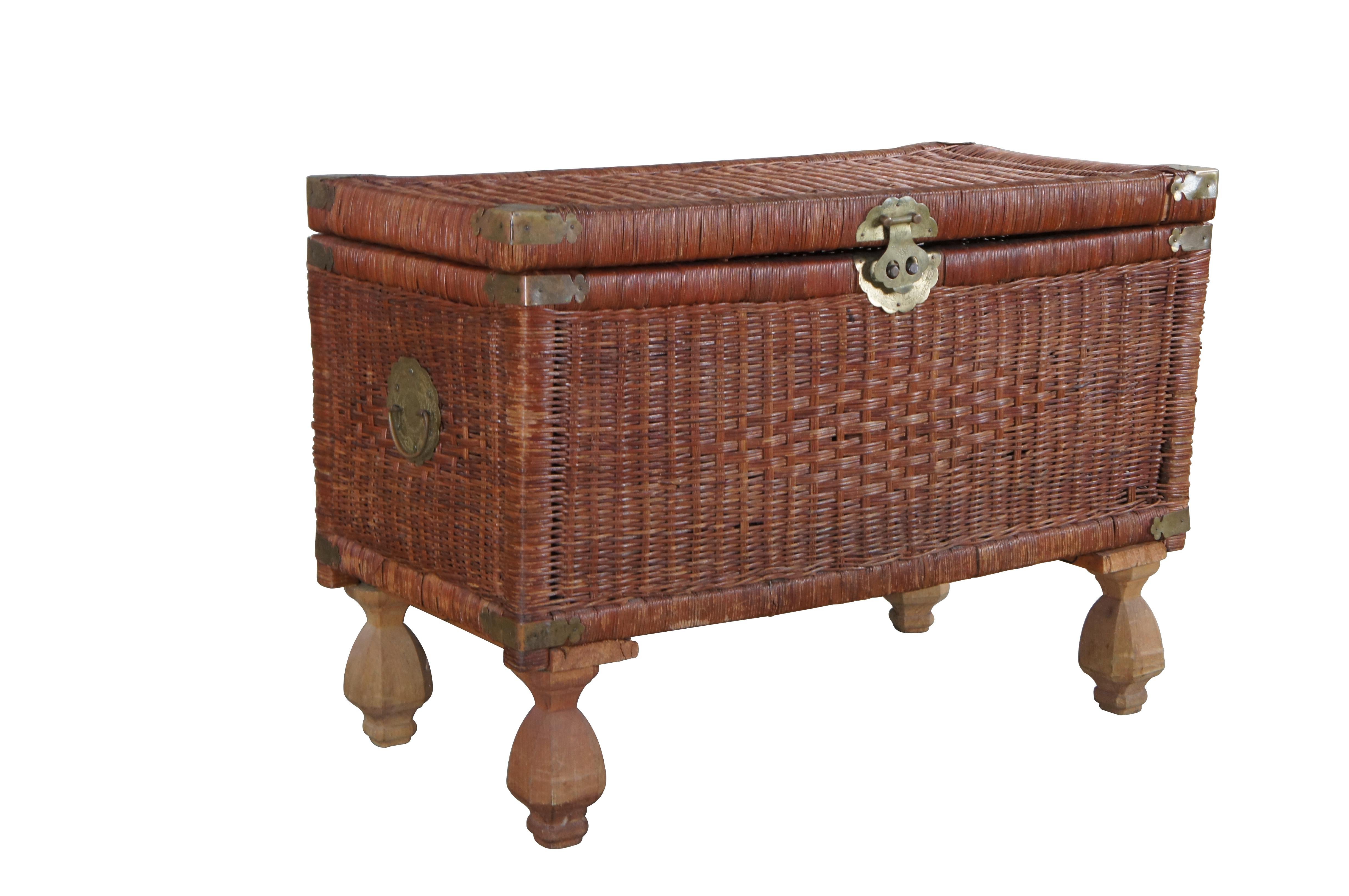 Bohemian Modern footed storage chest, circa 1970s.  Features a wicker frame with brass accents over bulbous wooden feet.  A fun addition to any space!

Dimensions:
32