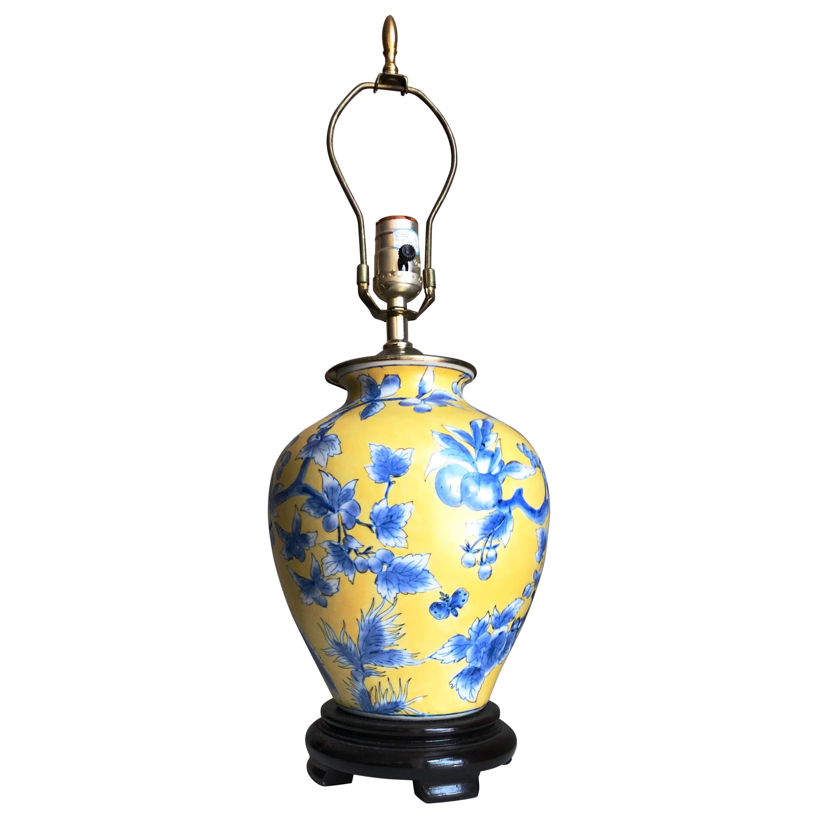 Gorgeous chinoiserie yellow and blue ginger jar / urn, porcelain, wired as a lamp, with hardwood base. Wonderful proportions. Brass accents.