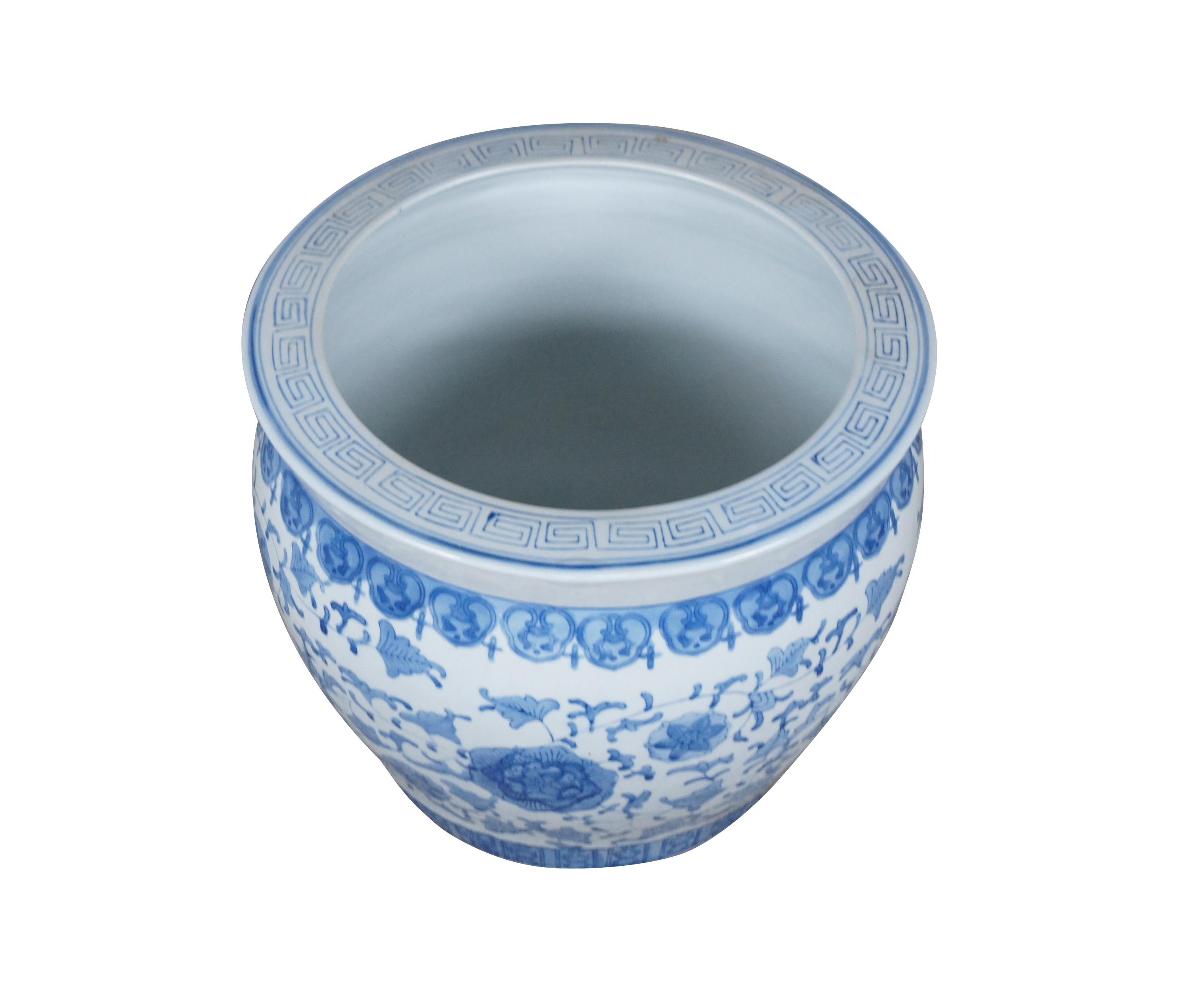 Vintage Fish Bowl Ceramic Planter featuring Hand Painted Chinoiserie Style Floral Motifs and Trim in Blue on a White Background. Measure: 17