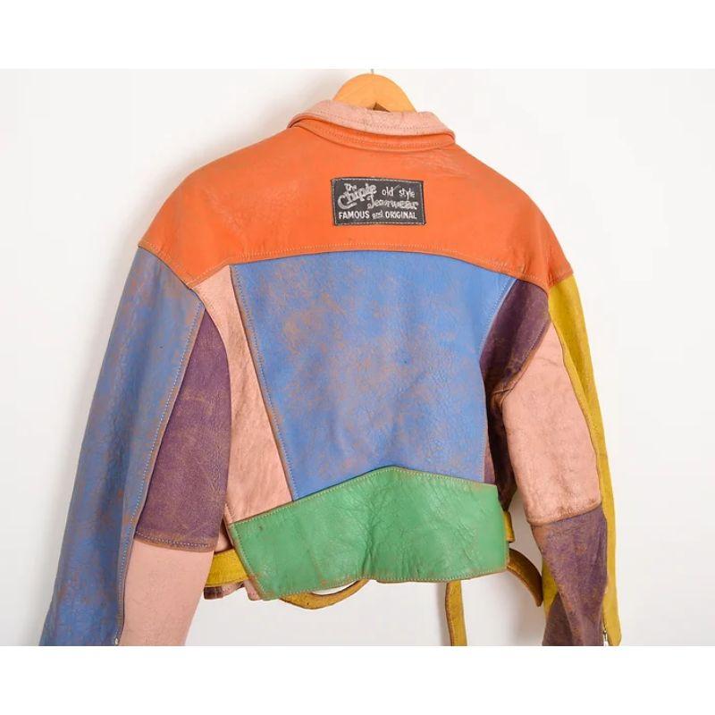 Vintage early 1990's CHIPIE colourful leather panelled slightly cropped biker jacket. Featuring large 'Chipie old style jeanswear - famous and original' patch to the reverse, detachable waist belt.

Features:
Long sleeves
Numerous exterior