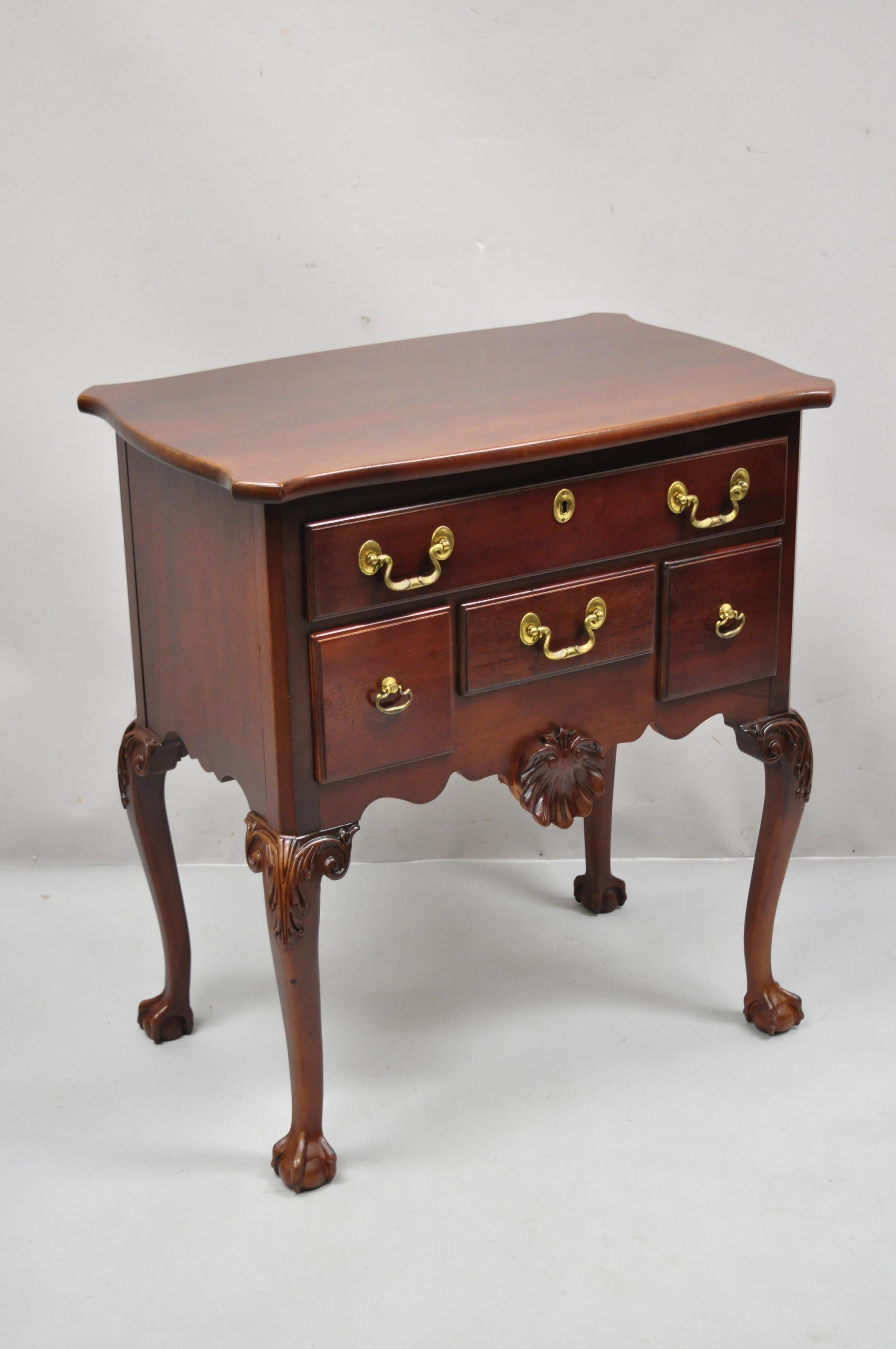 Vintage Chippendale solid mahogany ball and claw lowboy chest by Lexington Heirloom. Item features solid wood construction, beautiful wood grain, 4 dovetailed drawers, carved ball and claw feet, solid brass hardware, very nice antique item, quality