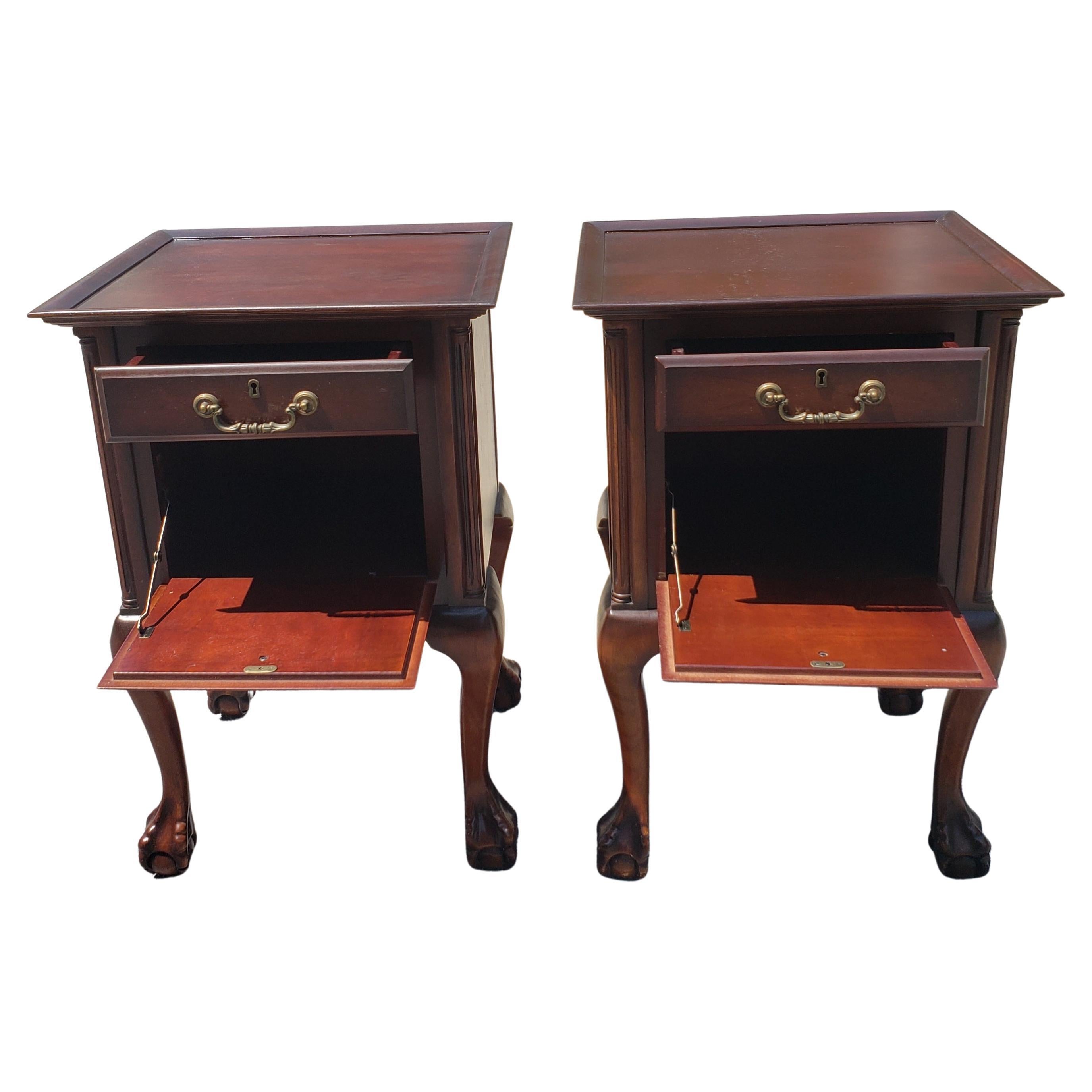 Unique set of vintage mahogany pair of nightstands side table. Table one drawer and large cabinet style storage space with pull down door. Table tops have just been refinished and are in excellent condition. Finished on all sides and back, making