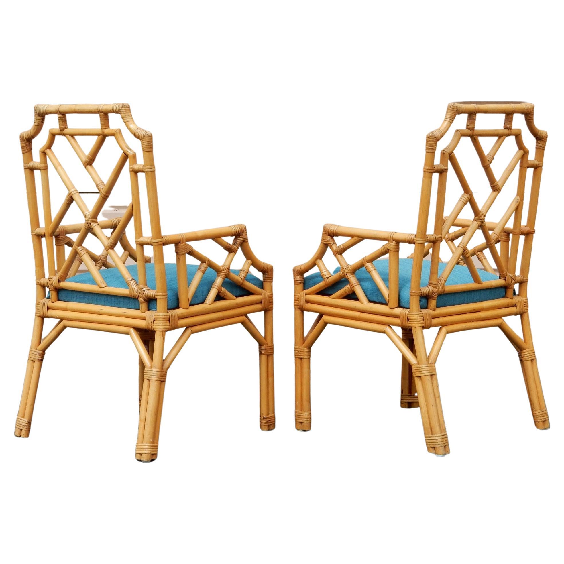 1970's French woven rattan arm chairs.
Set of 6. Expertly hand crafted of molded rattan
and woven cane covered in a shellac finish.
Upholstered teal blue cushions. 
These are fabulous chairs in very good original condition.
