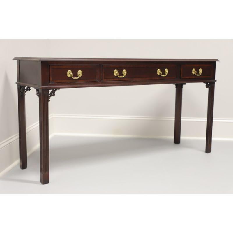 A Chippendale style sofa table by Pennsylvania House. Banded mahogany with three dovetailed drawers and brass hardware. Made in the USA in the late 20th Century.

Measures: 54W 16D 27.25H

Exceptionally good condition. All drawers function properly.