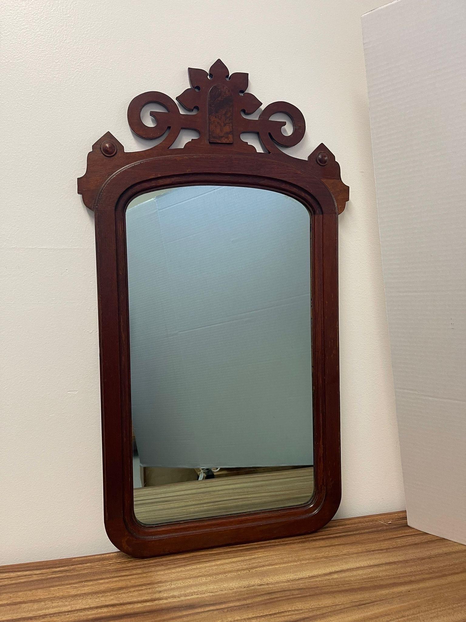 Vintage Blue Toned Mirror with Intricate Decorative Detailing on the Frame with Burl Accent. Possibly Antique According to Research . Vintage Condition Consistent with Age as Pictured.

Dimensions. 19 W ; 1 D ; 34 H
