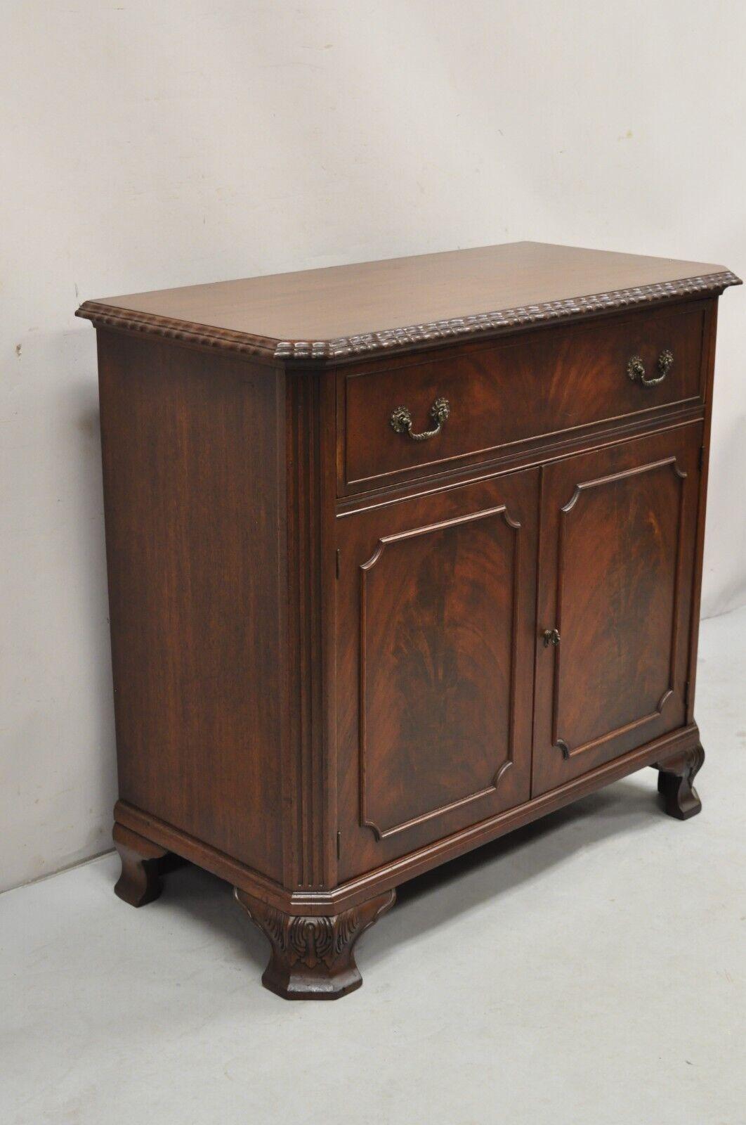 Vintage Chippendale Style Carved Mahogany Server Buffet with Bar Interior. Circa Early 20th Century. Measurements: 36.5