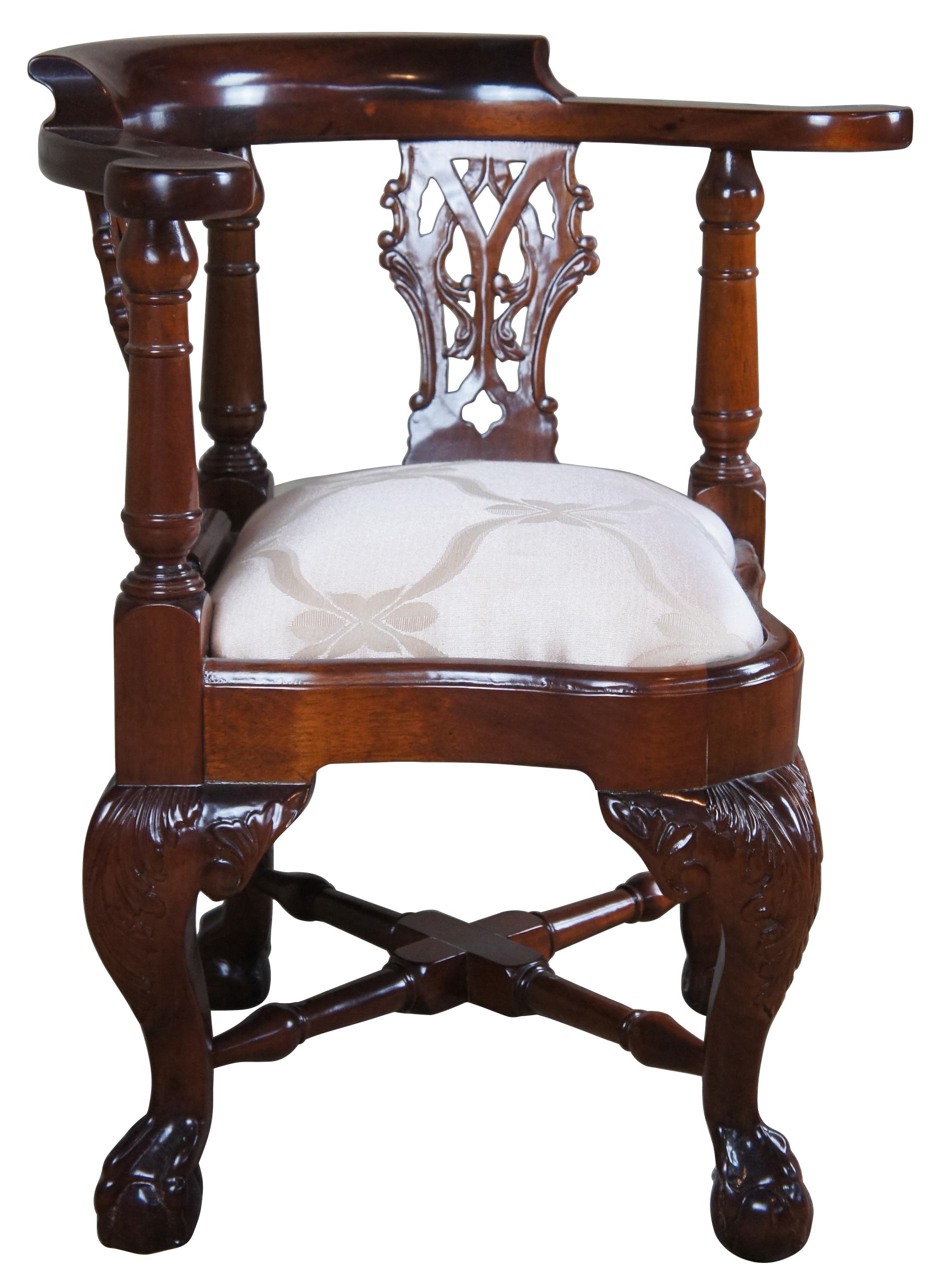 Late 20th century Chippendale child or dolls chair. Made exclusively for Georgian Furnishing Co., LTD. in New Orleans, LA. Made from Mahogany with a curved rail over pierced splats and turned supports. Upholstered with a pink seat in Classic French