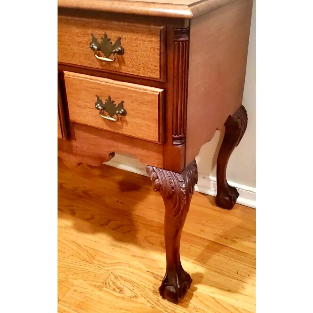 Fantastic vintage Chippendale lowboy. Beautiful hand carved sunrise design. Long and slender cabriolet legs. Acquired from a Palm Beach estate. The lowboy is in great structural shape. Minor scuffs and blemishes appropriate to its age and use. The
