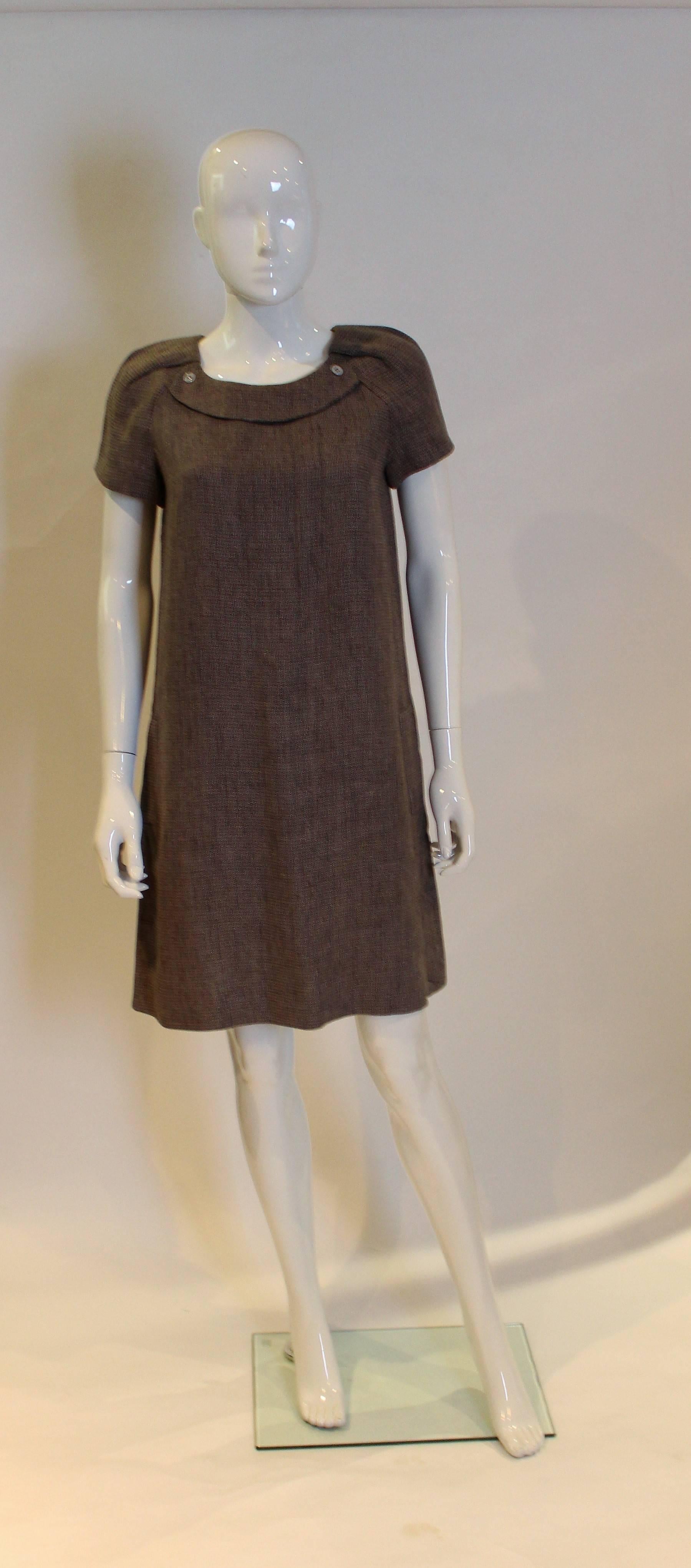 A great little black dress for Spring/Summer by Chloe. In a cotton /linen mix and fully lined, this dress has a round neck, short sleeves and two pockets. It opens with a beautifuly hidded zip at the back.