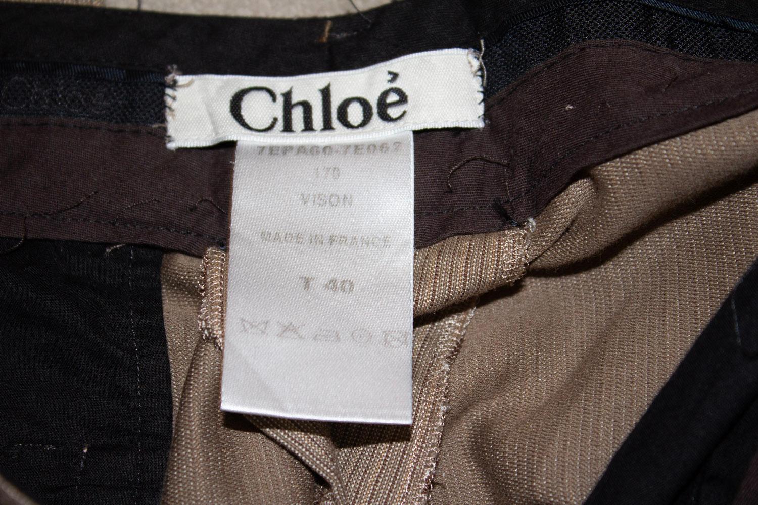 A chic pair of vintage trousers by Chloe. In a cotton and silk mix , the trousers are a colour palette of taupe and various shades of brown.  The trousers have a pocket on either side and belt hoops. 
Size 40 Made in France 
Waist 29'' Inside leg