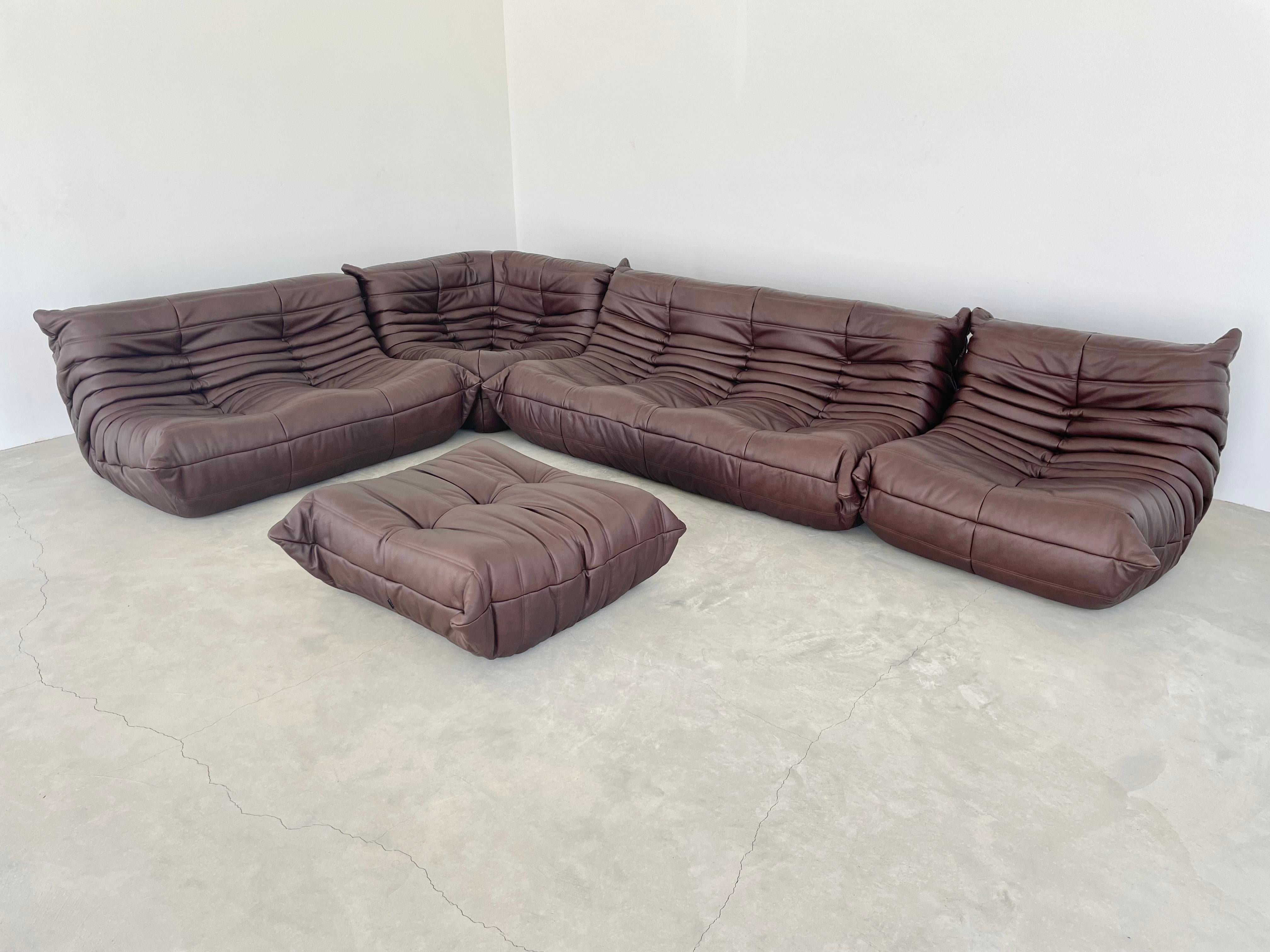 Classic French Togo set by Michel Ducaroy for luxury brand Ligne Roset. Originally designed in the 1970s the iconic togo sofa is now a design classic. This set comes in it's original chocolate brown leather.

Timeless comfort and style make this
