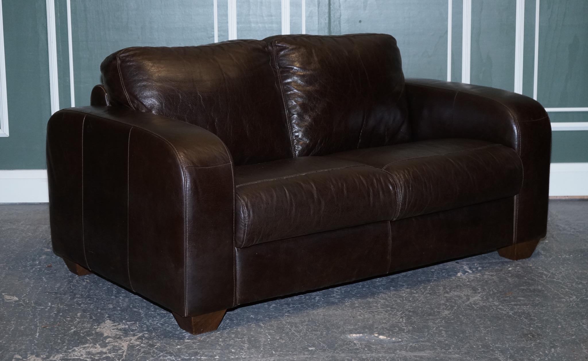 We are delighted to Present This Stunning Chocolate Brown Leather Two Seater Sofa.

The sofa is made by Sofitalia which is an established Italian company, the leather is of very good Italian cow-hide quality and still has plenty of life to