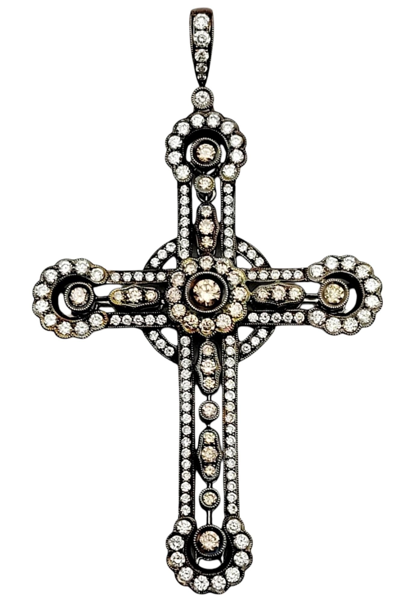 Step back in time and discover the allure of this exquisite vintage cross pendant, beautifully adorned with a captivating array of chocolate and white diamonds. This pendant showcases a large sparkling cross with rounded edges, emanating elegance