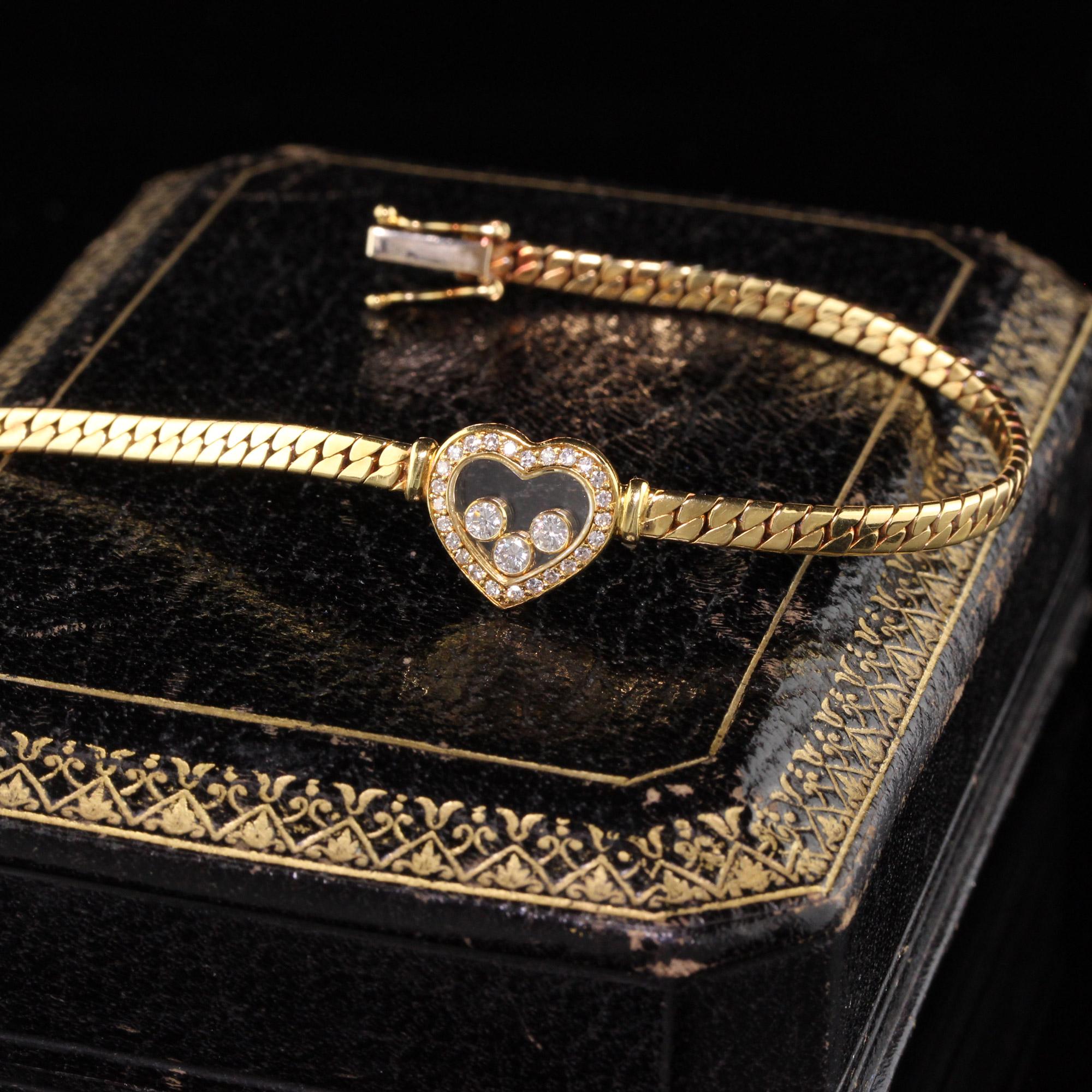 Stunning Chopard Happy diamonds heart bracelet. The heart contains 3 floating diamonds inside of the glass case.

#B0014

Metal: 18K Yellow Gold

Weight: 12.2 Grams

Measurements: 7.3 inches in length

Heart Measurements: 11.7 x 10.7 mm