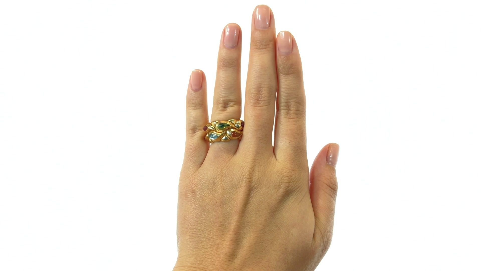 Vintage Chopard Casimir Collection Gemstone 18 Karat Gold Ring. Featuring cabochon pear-shape citrine, amethyst, tourmaline, quartz, topaz, and peridot. Signed Chopard serial #9164466. Circa 2000s.

About The Piece: Desired and coveted, this Vintage