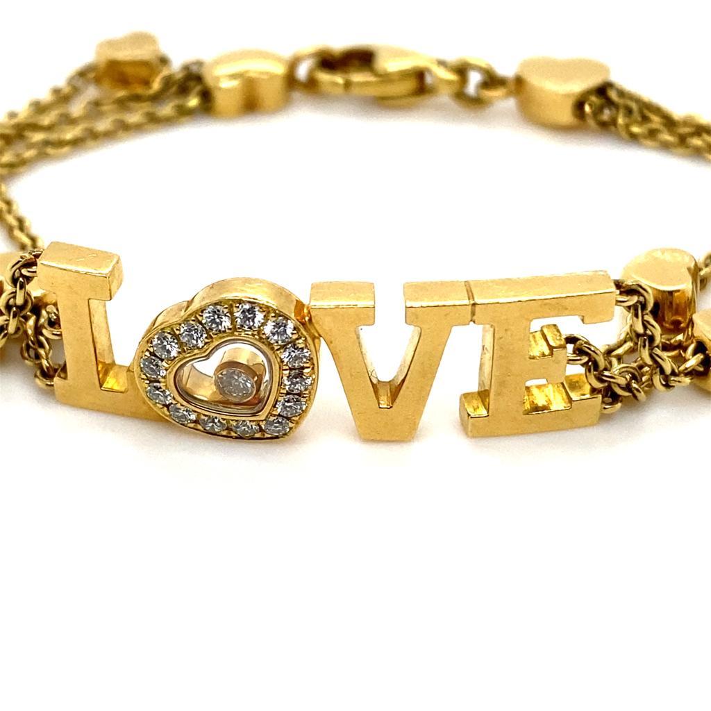 A vintage Chopard diamond Love bracelet in 18 karat yellow gold, circa 1995.

This bracelet from Chopard's iconic Happy Diamonds collection is designed as a solid yellow gold word spelling out 'LOVE' to its centre with the 'O' taking the form of a