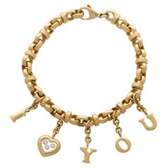 Chopard Bracelet à breloques vintage Happy Diamonds « I Love You » en or 18 carats et diamants