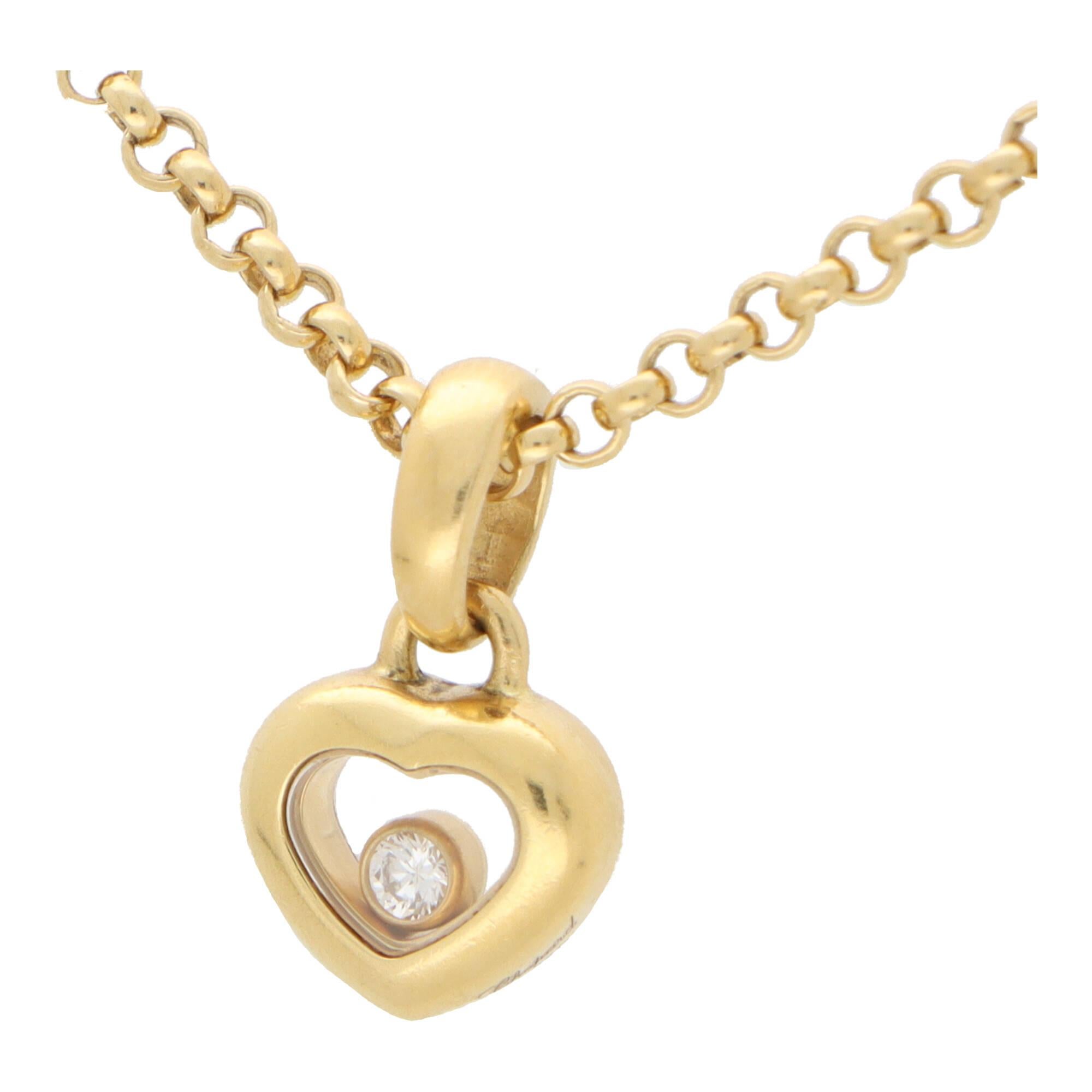 A stylish vintage Chopard ‘Happy Diamond’ pendant necklace set in 18k yellow gold.

The pendant is from the current Happy Diamond collection and features a open-heart motif, with a single floating rub over set diamond in the centre. The diamond