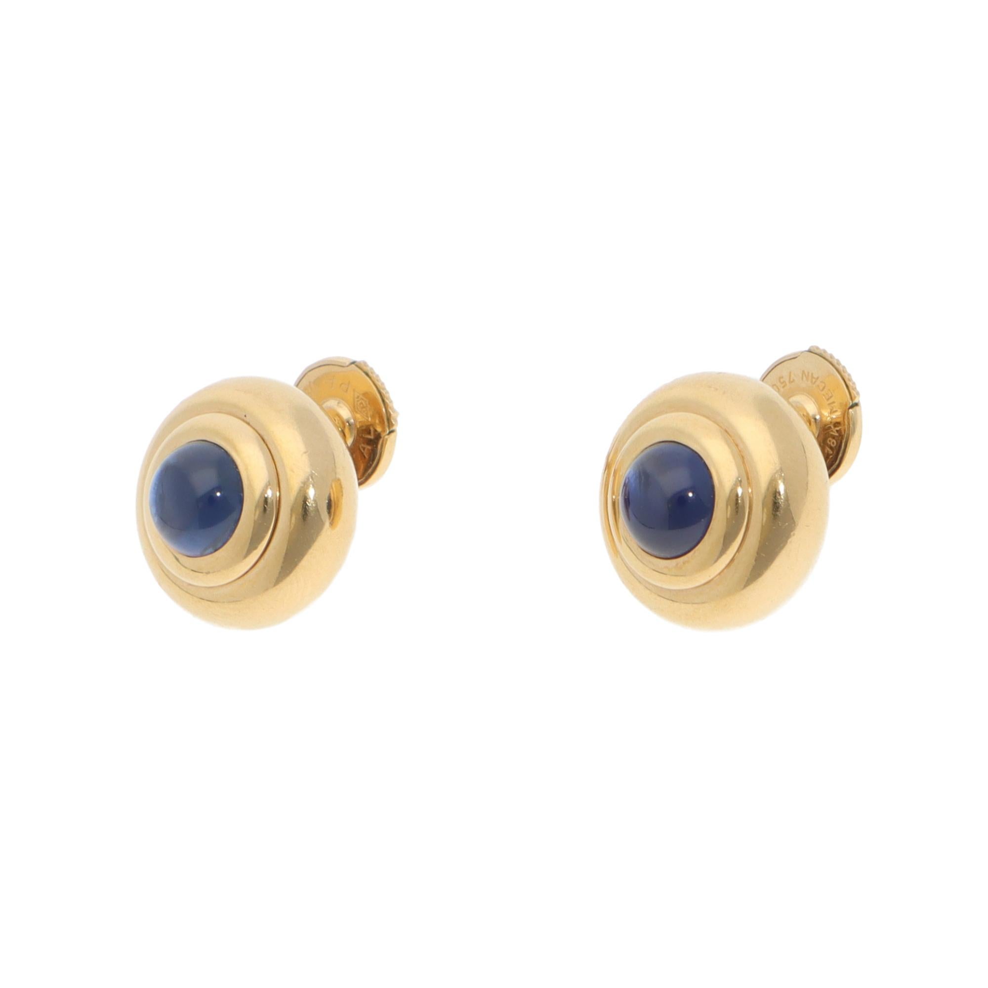 An elegant pair of vintage Chopard sapphire stud earrings set in 18k yellow gold.

From Chopard’s discontinued collection, each earring is composed of a round motif in polished yellow gold. Set to the centre of each motif is a cabochon sapphire,