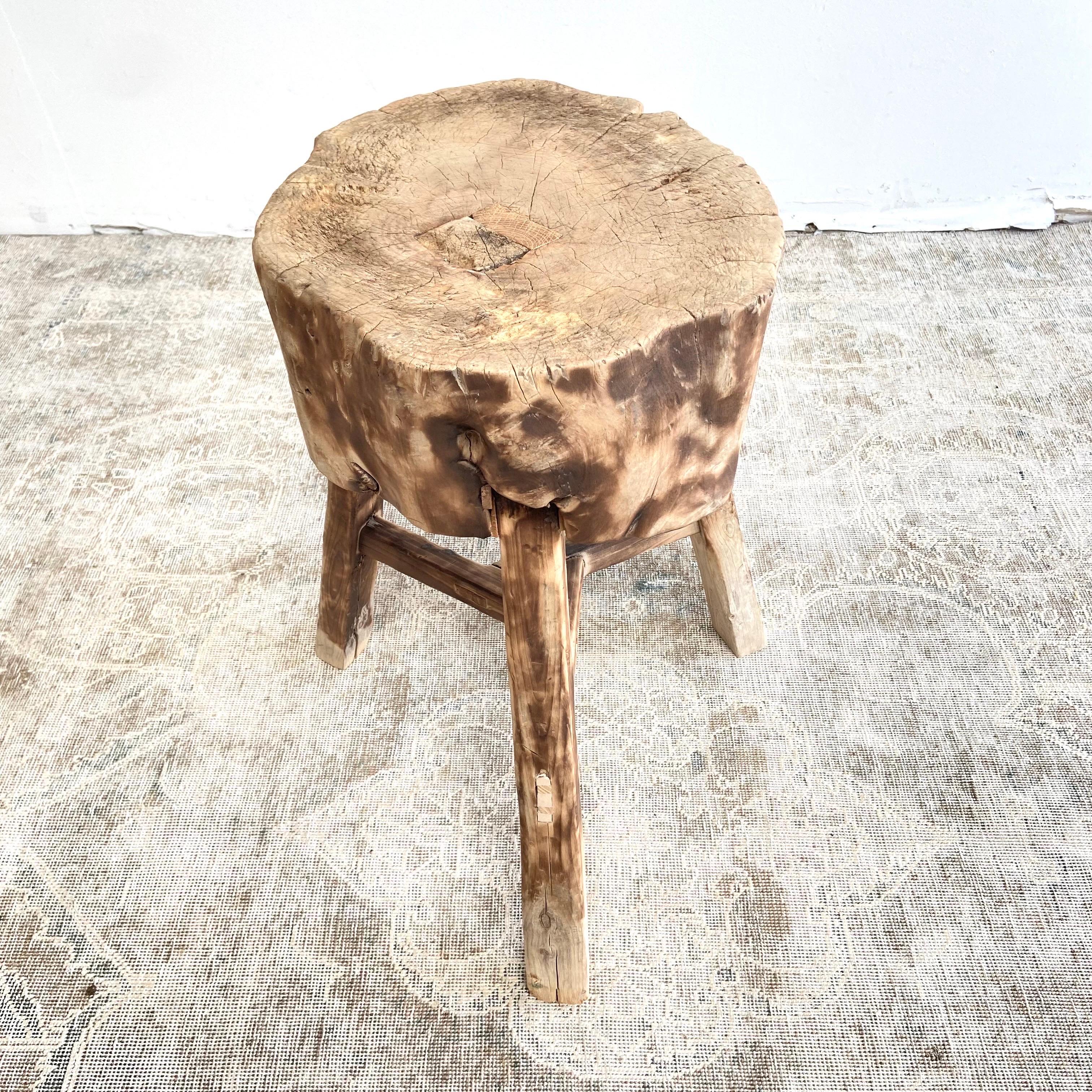 Chop block side table 
This solid stump slice was turned into a side table or stool. The solid thick top has a beautiful movement with unique characteristics. A natural live edge to show shape and form of what was. Solid and sturdy, perfect earthy
