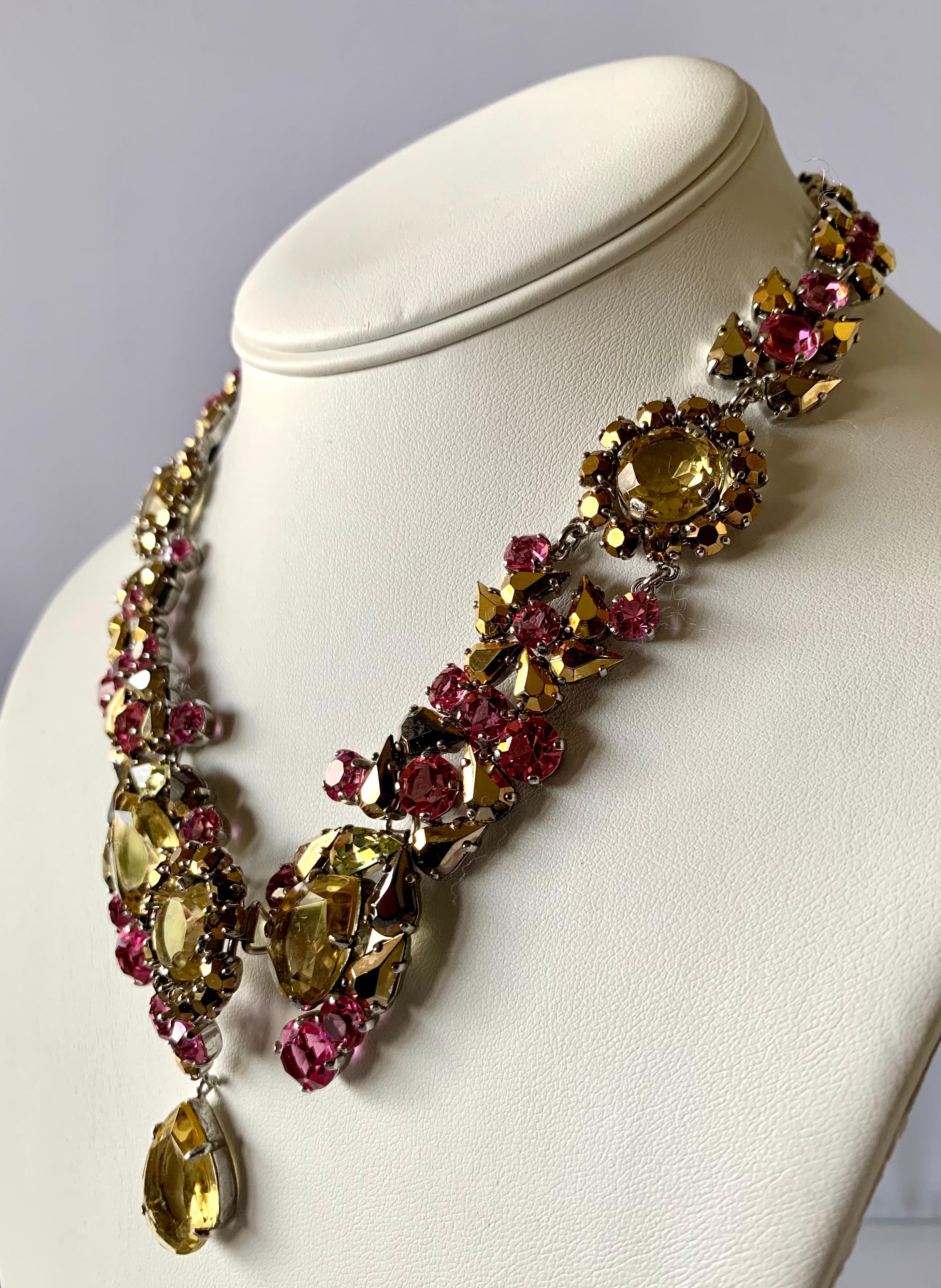Exquisite vintage Christian Dior necklace, comprised out of silver-tome metal the necklace features a romantic design with large prong-set faceted citrine, gold, and pink rhinestones - the necklace is signed Christian Dior 1958.

What makes this
