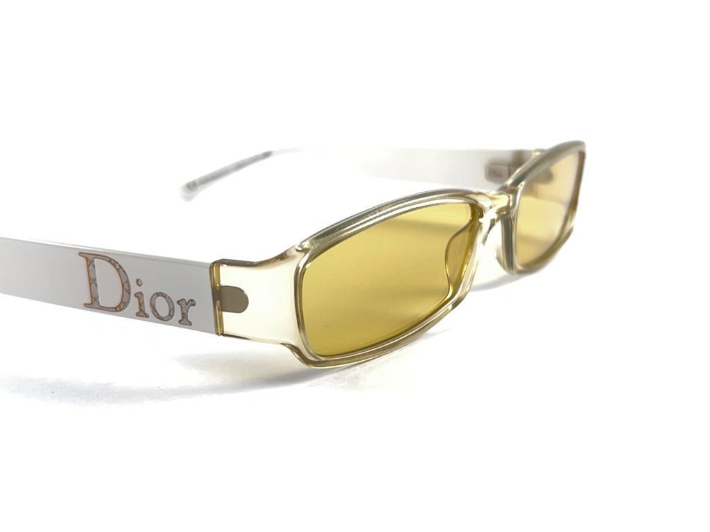 Classy And Eye Catching Vintage Christian Dior Rectangular Translucent Yellow Holding A Pair Of Light Yellow Lenses

New! Never Worn Or Displayed

This Item May Show Minor Sign Of Wear Due To Storage



Made In Italy


Front                         