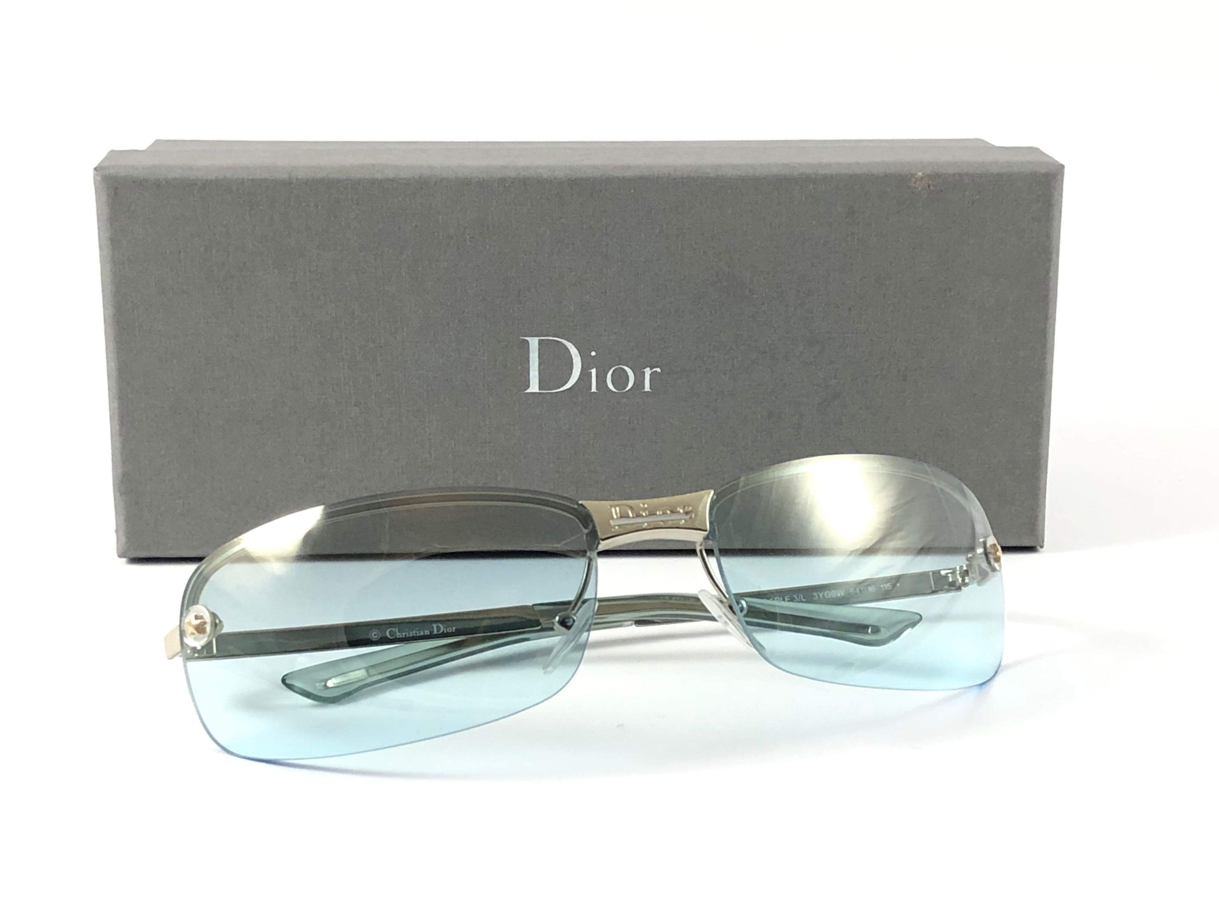 Vintage Christian Dior Adiorable silver with light mirrored turquoise lenses Wrap Sunglasses Fall 2000 by Galliano.

Made in Austria.
 
This piece show minor sign of wear due to  storage.

Front : 16 cms

Lens Height : 6.5 cms

Lens Width : 3.6 cms 