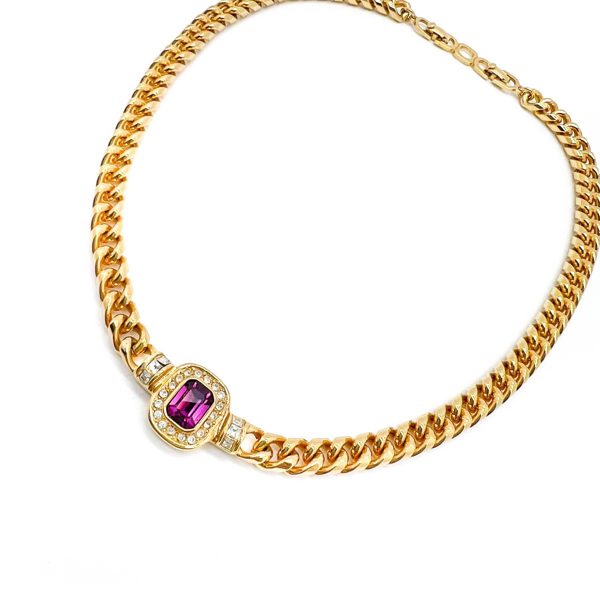 A timeless Vintage Dior Amethyst Necklace. A lustrous chunky curb chain is finished with an amethyst emerald cut crystal surrounded by chaton crystals. Edgy and demure. A perfect classic from the iconic House of Dior.

With archive pieces from her