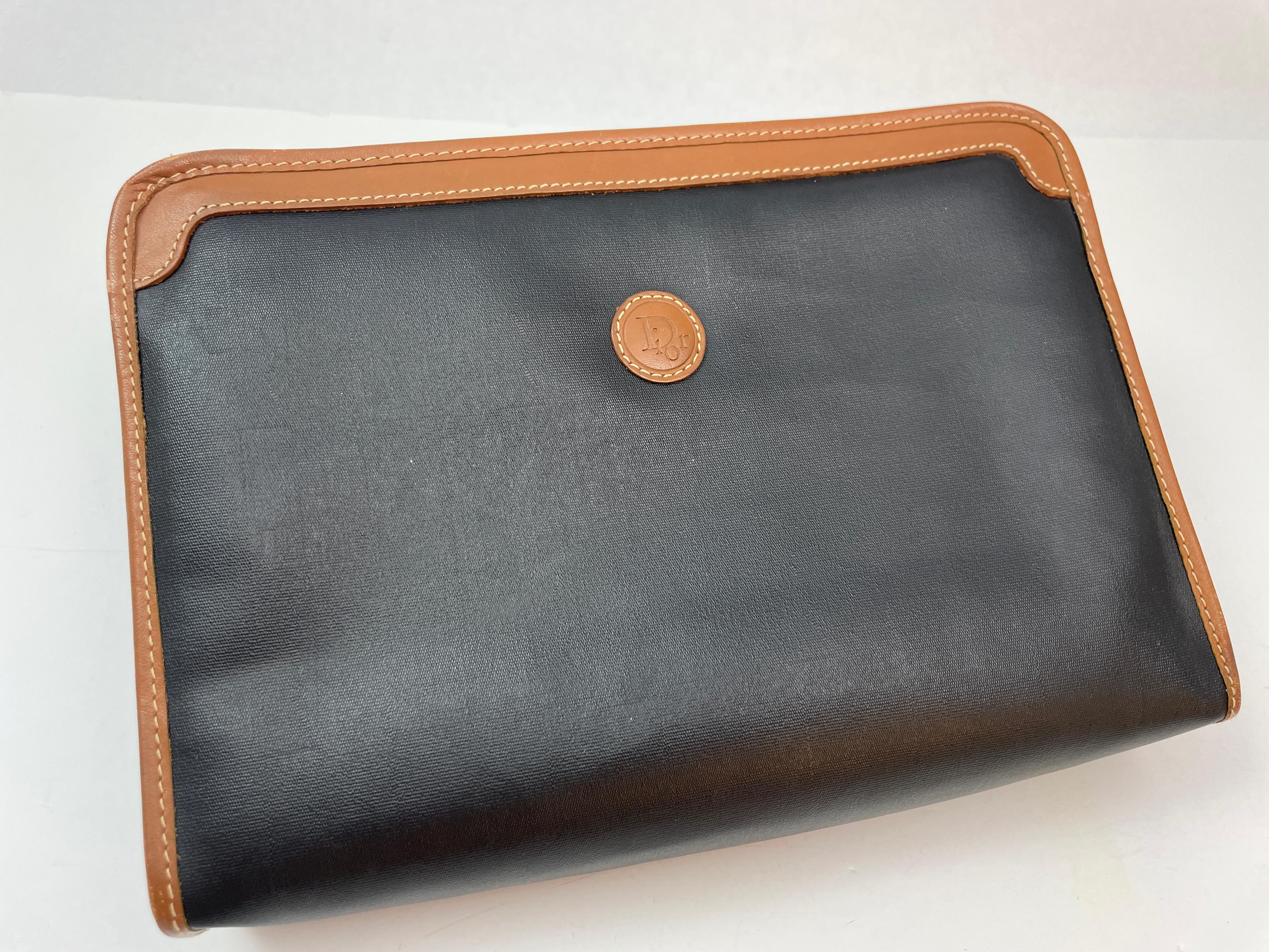 Vintage Christian Dior Black Canvas Toiletry Bag with leather DIOR logo, top zip fastening and one small side and main compartment.
Christian Dior Vintage Coated Canvas Cosmetic Pouch Bag Clutch.
Christian Dior Zipper Case  with Tan Trim