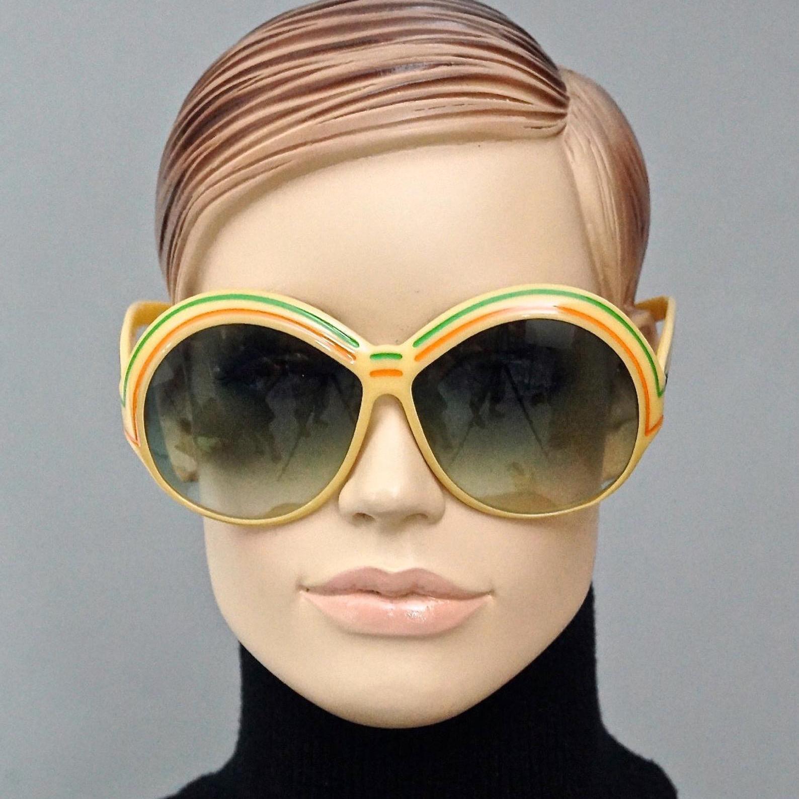 Vintage CHRISTIAN DIOR Round Oversized Stripe Sunglasses

Measurements:
Height: 2.71 inches (6.9 cm)
Horizontal Width: 5.90 inches (15 cm)
Temples: 4.92 inches (12.5 cm)

Features:
- 100% Authentic CHRISTIAN DIOR.
- Round oversized space age