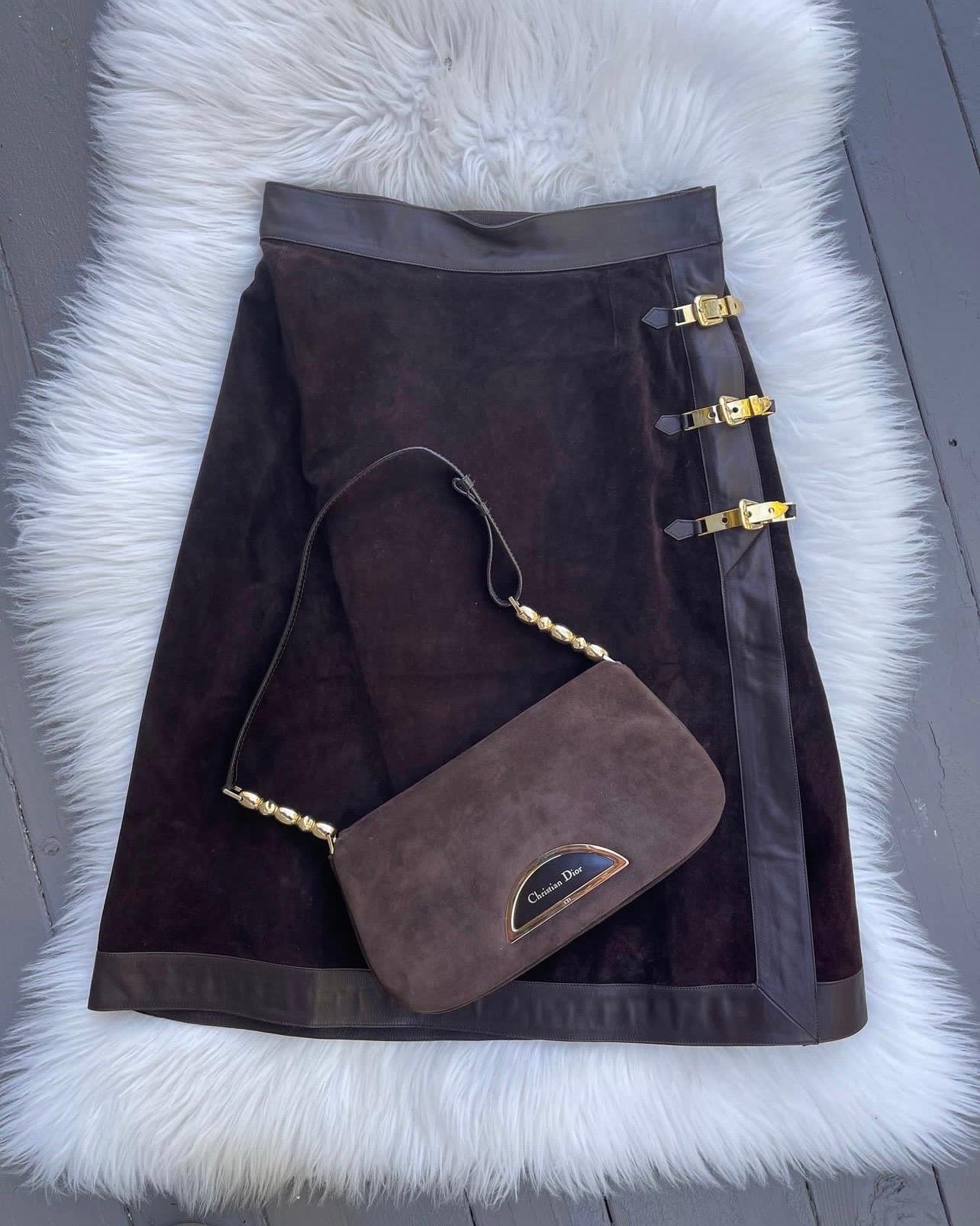 Vintage Christian Dior Malice bag 
*includes Authenticity Card

Christian Dior logo monogram on front inlay and CD stamped on hardware. 
Gold tone hardware with brown strap / interior
Tuck in the strap and you can carry it as a clutch. 
NOTE: straps