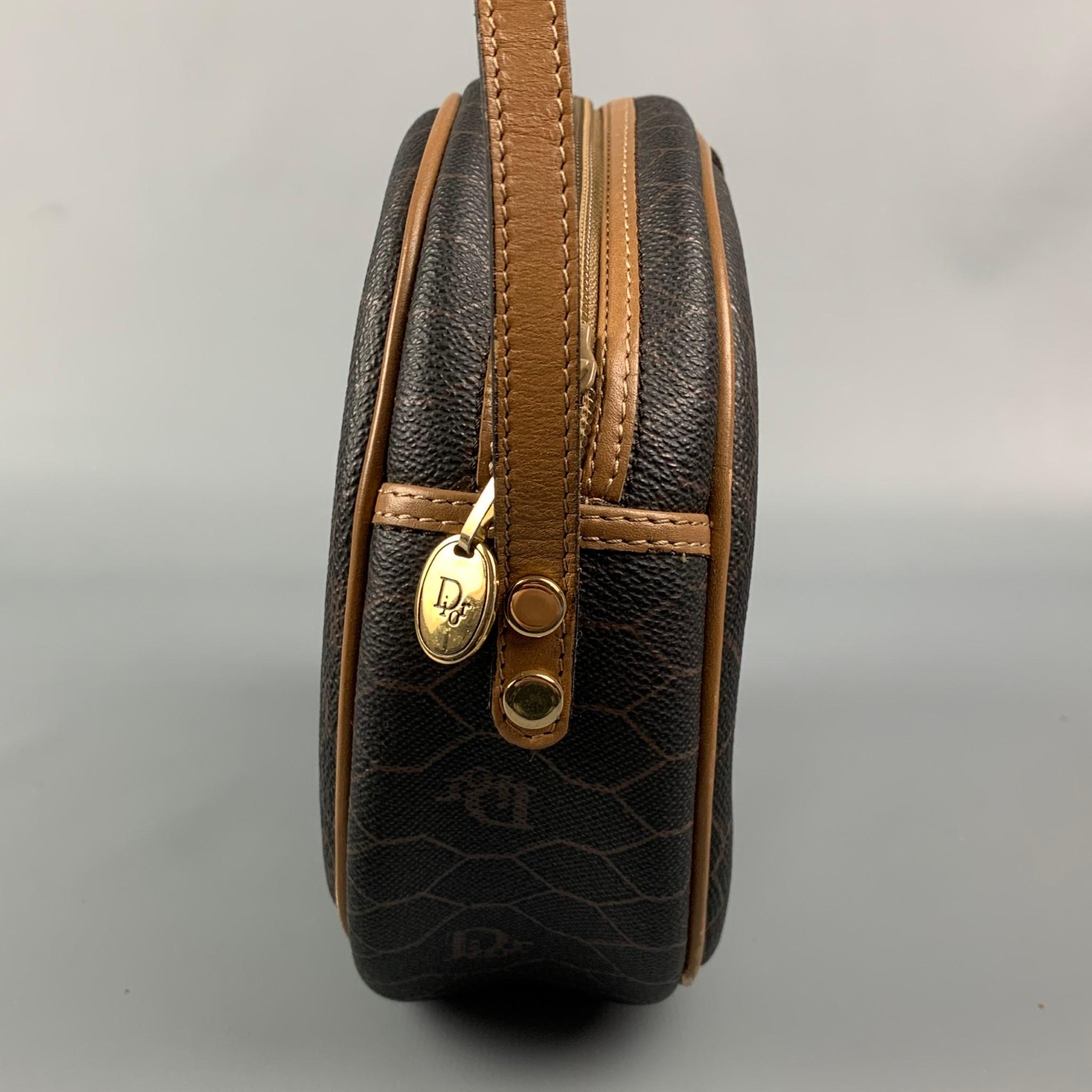 Vintage CHRISTIAN DIOR bag comes in a brown & beige honeycomb pint coated canvas featuring a shoulder strap, front gold tone logo emblem, inner pocket, and a zipper closure. Made in France. 

Very Good Pre-Owned Condition.

Measurements:

Length: