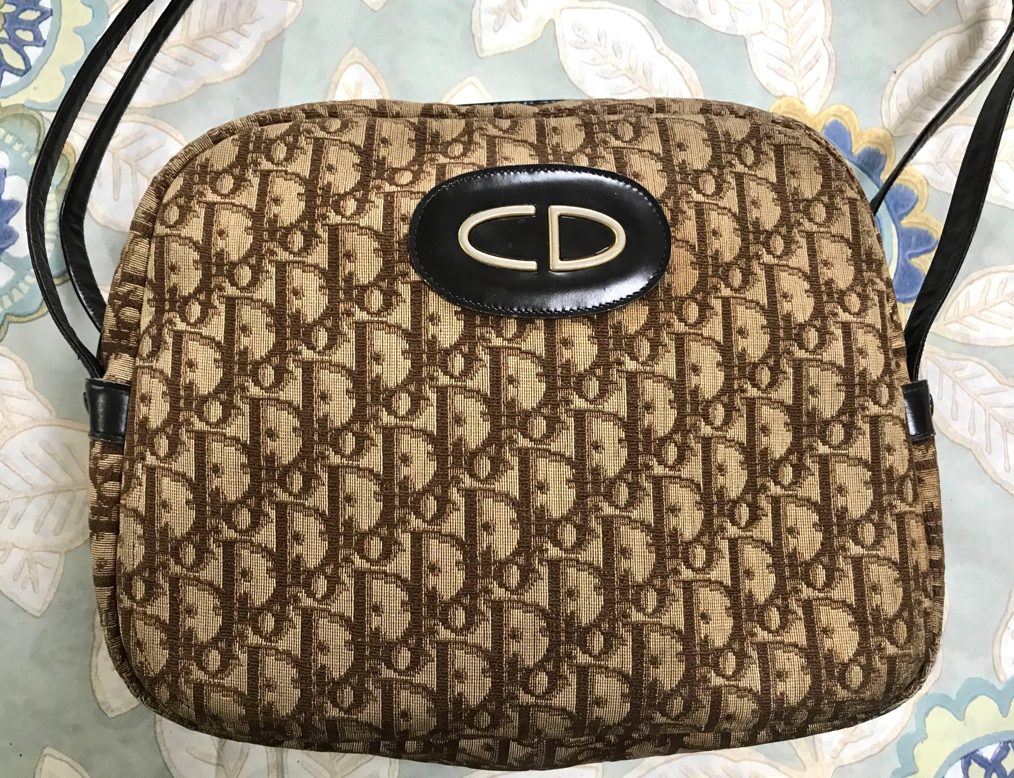 1970s-1980s. Vintage Christian Dior brown trotter jacquard bag with leather straps and a gold tone large CD motif.

So chic and soooo vintage Dior!! Would fit with any outfits and season! Can hold lots of things you need.

This is a Christian Dior