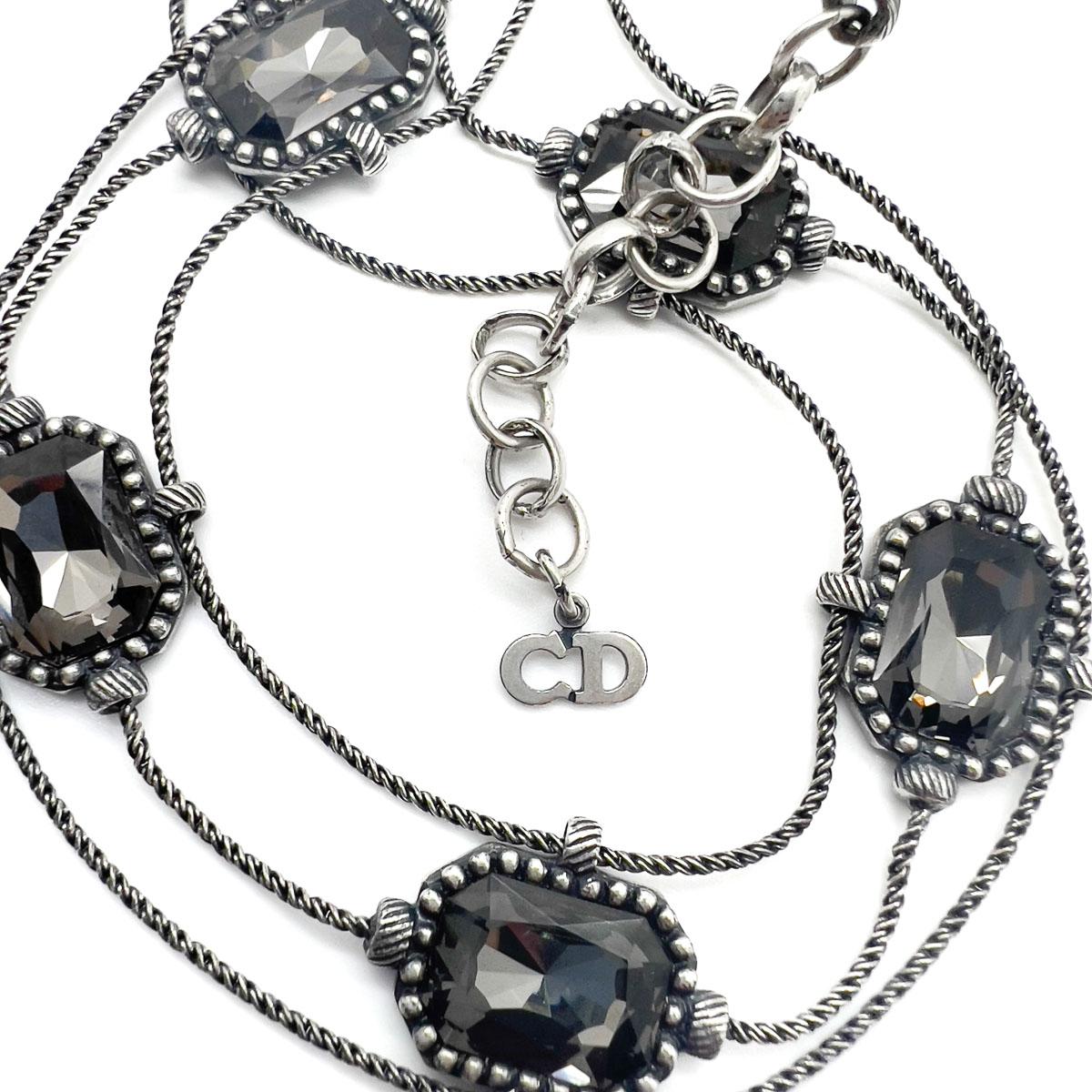 A sublime Vintage Christian Dior Blackened Crystal Choker from Galliano's much revered tenure at the House. Large faceted smoky grey crystals adorn a line of gunmetal rope link chain, almost wire-like. Contemporary in overall design with the