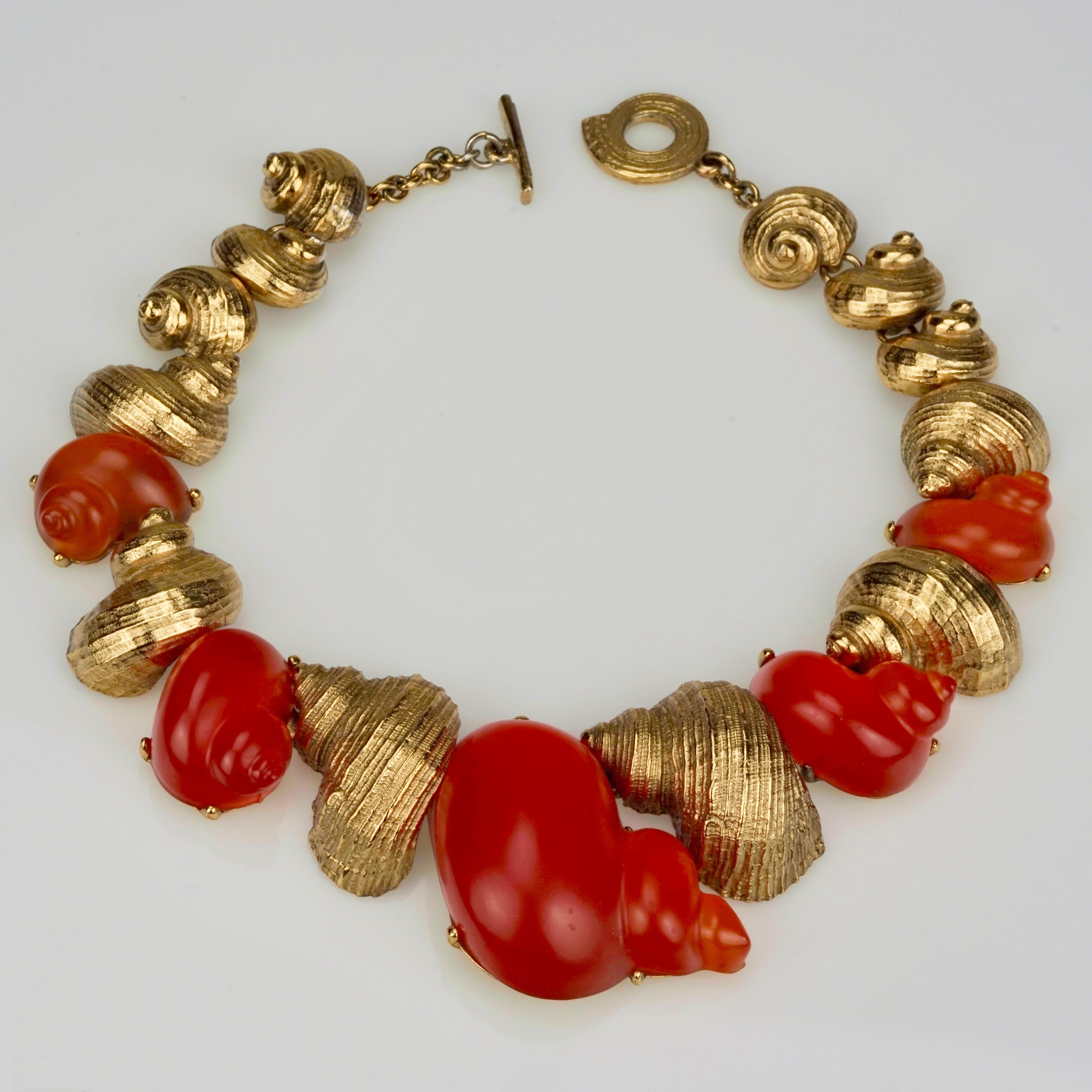 Vintage CHRISTIAN DIOR by Robert Goossens Lucite Shell Choker Necklace

Measurements:
Height: 2 3/8 inches
Wearable Length: 16 4/8 inches

Limited edition Christian Dior necklace is designed by Robert Goossens for the perfume DUNE in 1987. Very