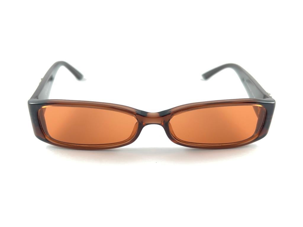 
Classy And Eye Catching Vintage Christian Dior  Cd 3156 Brown Translucent Frame Holding A Pair Of Light Orange Lenses Sunglasses.

New! Never Worn Or Displayed

This Item May Show Minor Sign Of Wear Due To Storage, Please Study The Pictures Before