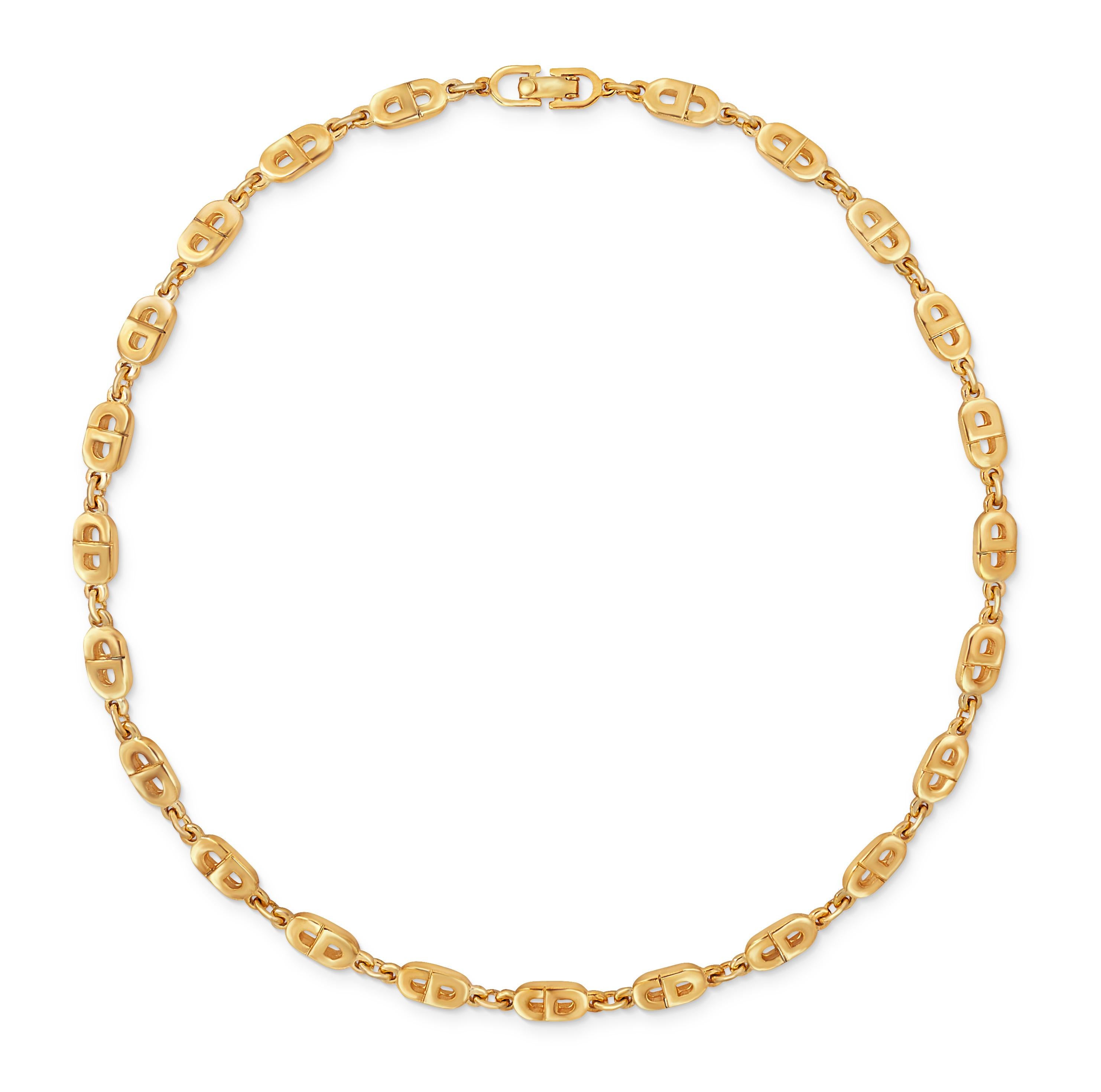 Vintage 1990s Christian Dior CD logo chain choker necklace in gold plate.  This necklace comprises small puffy CD logo links and sits perfectly at choker length.  Length 15.5 inches, width 1/4 inch with a foldover clasp closure.  Very good condition