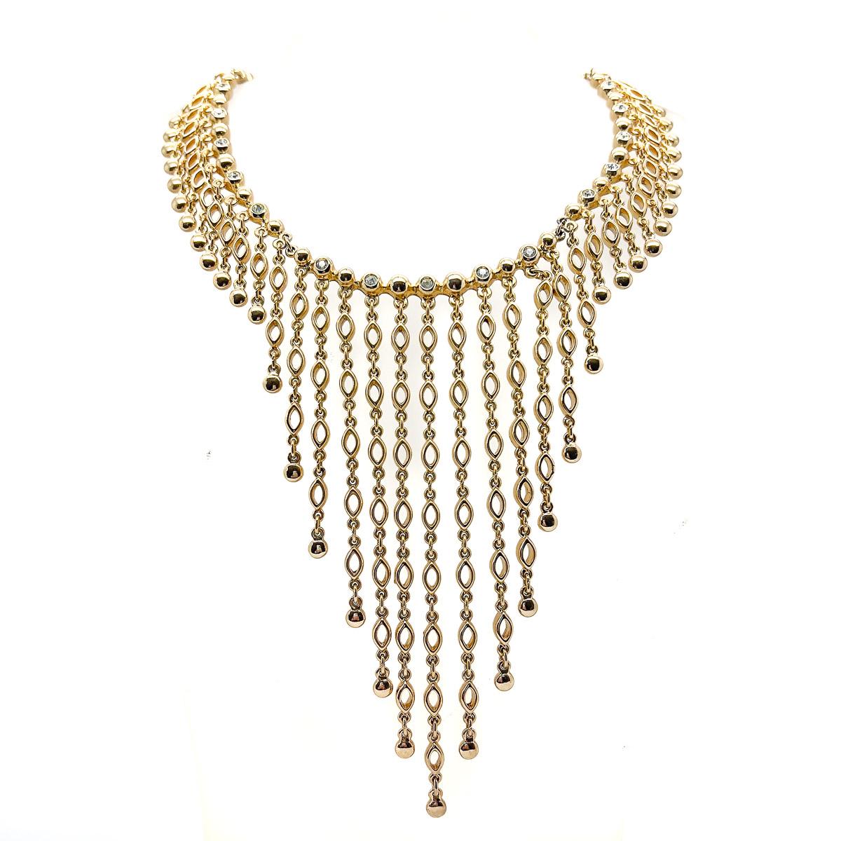 A spectacular and grand Vintage Christian Dior Crystal Cascade Necklace. Drops cascade from the collar to mesmerizingly beautiful effect. The tiny rhinestones adding a hint of sparkle to the lustrous and luxurious gold at the neckline. The drop