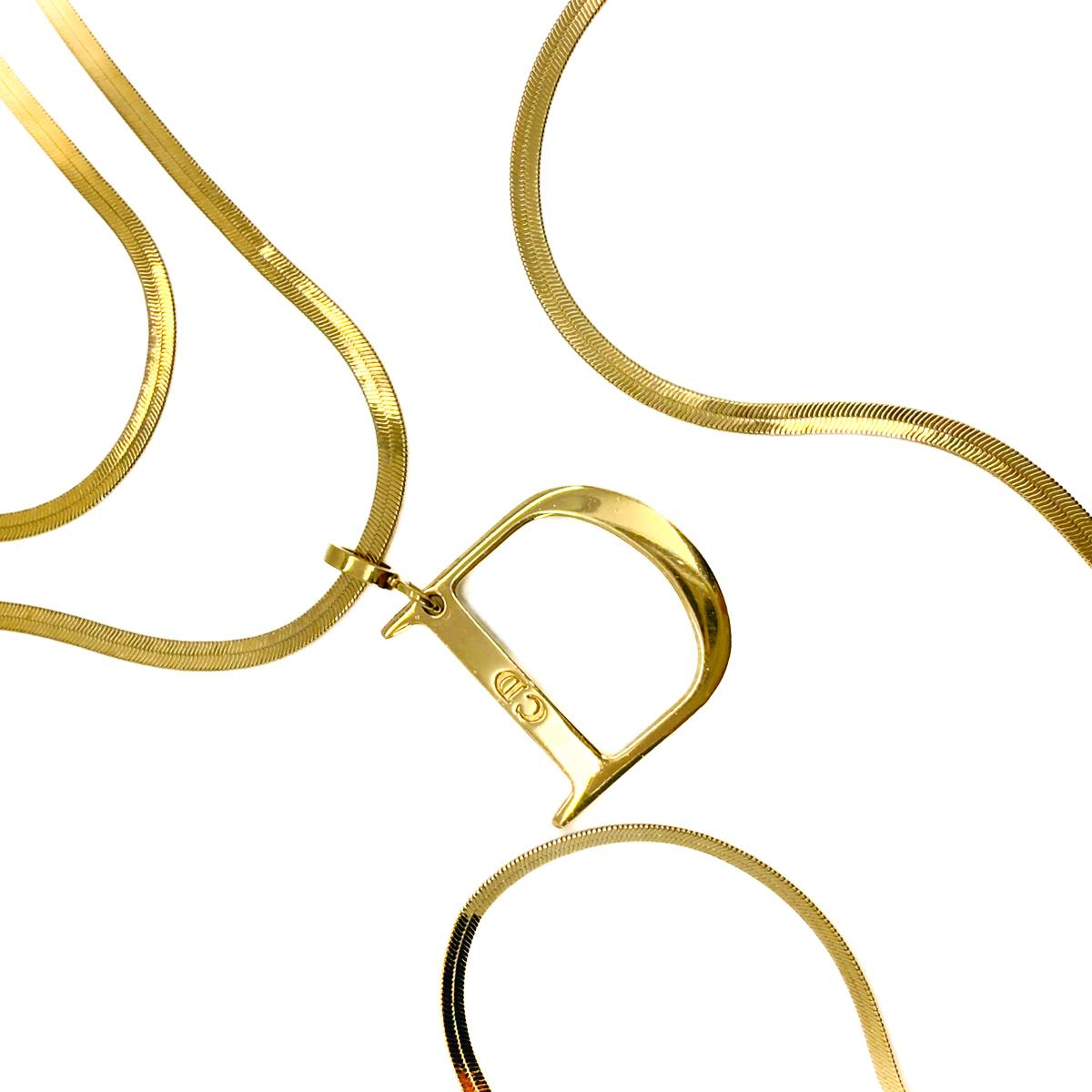A stunning Vintage Dior D Snake Necklace. A trio of snake link chains in graduated lengths drop beautifully from the neck down. Creating a vision of elegance with a twist of an iconic logo - a large D pendant denoting one of the world's most famous
