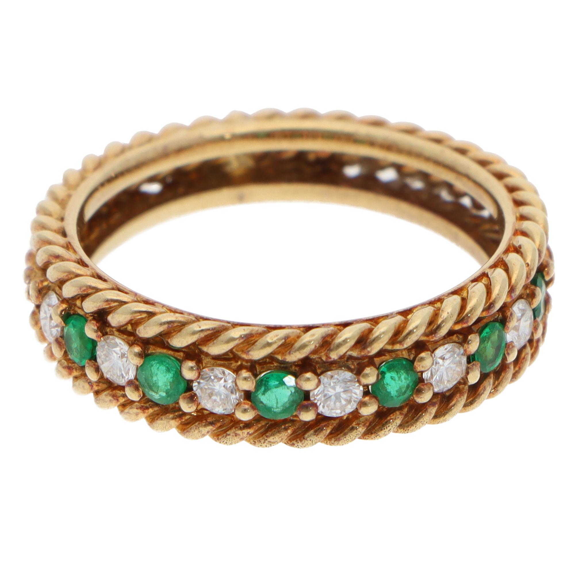 A stylish vintage Christian Dior emerald and diamond half-eternity rope ring set in 18k yellow gold.

The ring is composed of 6 round mixed-cut emeralds and 6 round brilliant-cut diamonds. The vivid green emeralds perfectly match in colour and